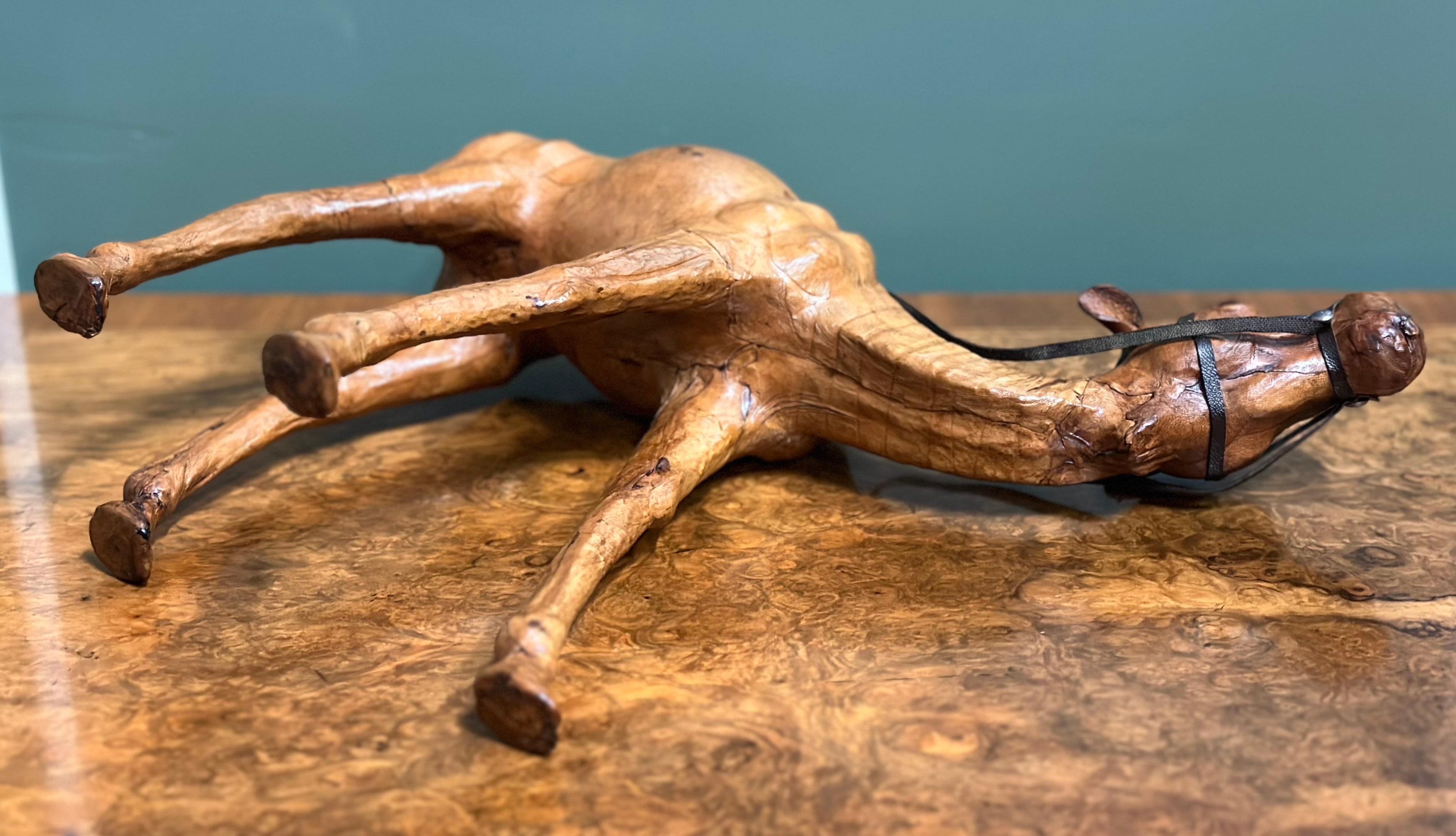 We are excited to present this camel sculpture with lovely aged leather on hand-carved wood.
It has been made for Liberty's in London.

This full-grown and very realistic dromedary or camel has both great aesthetic and decretive value.
They have