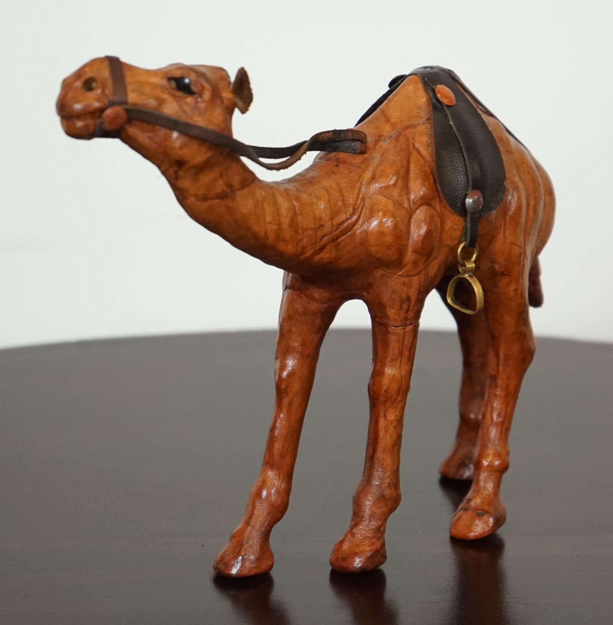 
We are delighted to present this camel sculpture with lovely aged leather on hand-carved wood. It has been made for Liberty's in London.

This lovely camel has both great aesthetic and decretive value.
It has been made for the kids of the wealthy