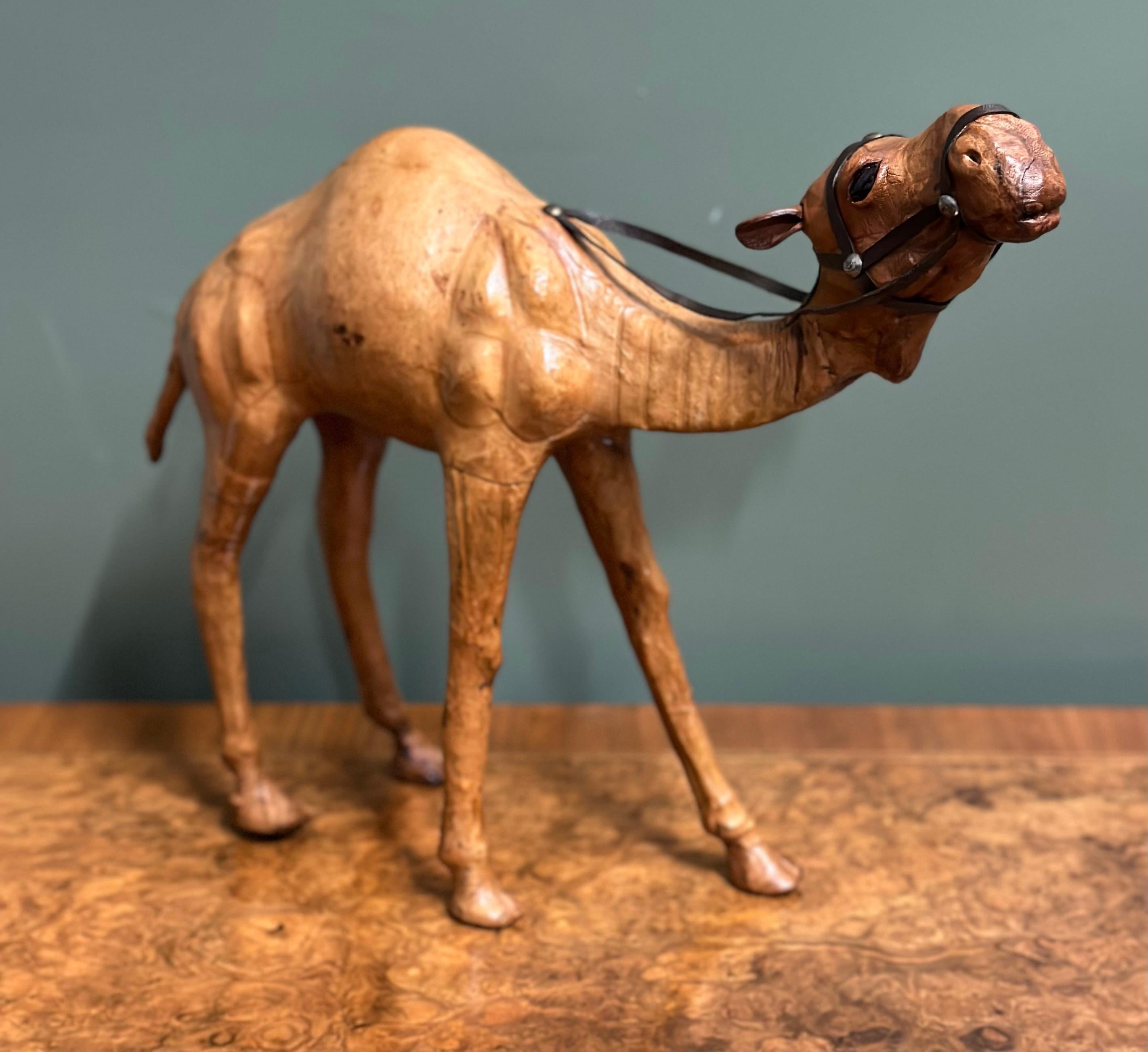 British Liberty's London Camel Sculpture with Lovely Aged Leather on Hand Carved Wood For Sale