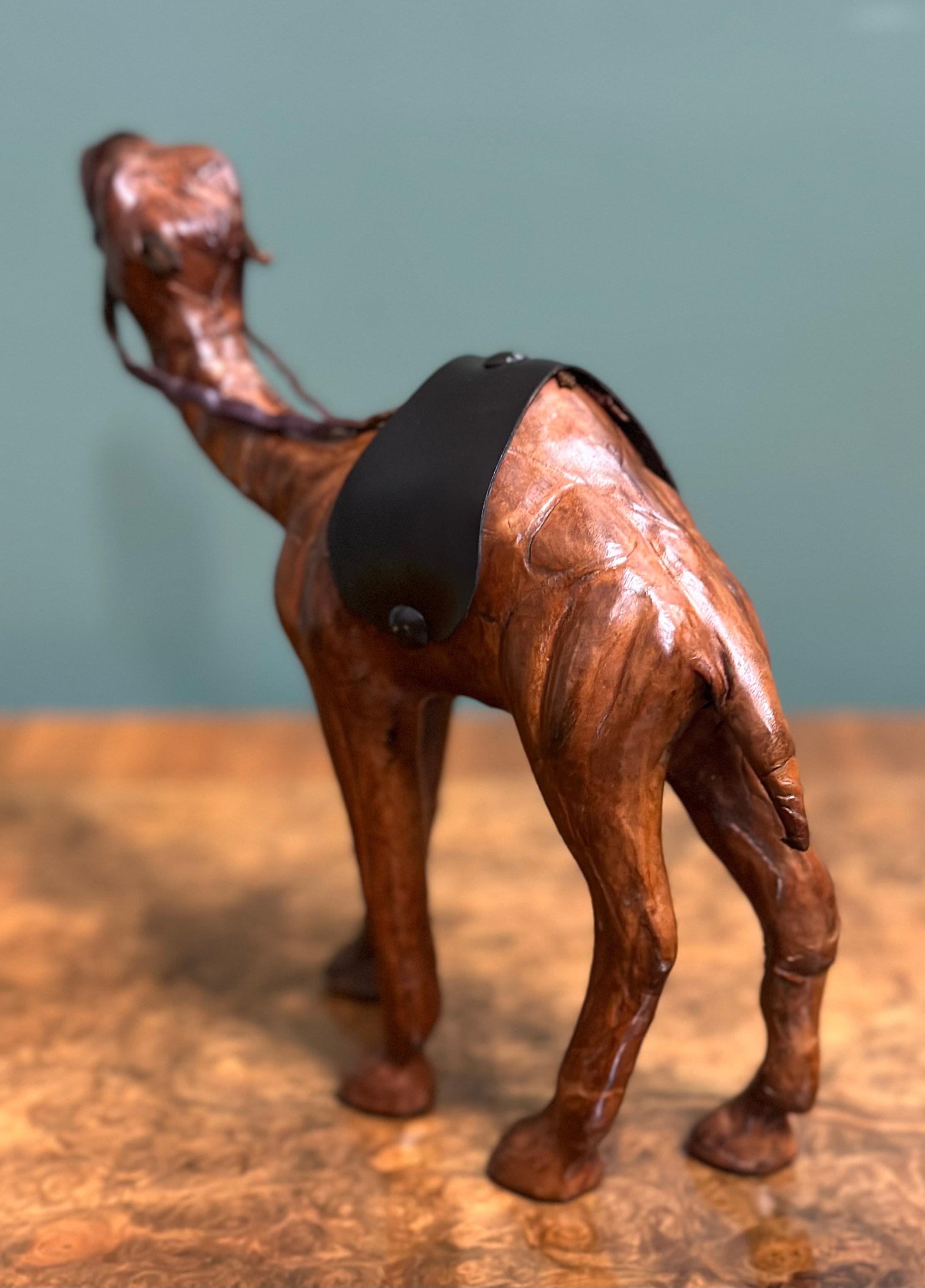 Hand-Crafted LIBERTY'S LONDON CAMEL SCULPTURE WiTH LOVELY AGED LEATHER ON HAND CARVED WOOD  For Sale