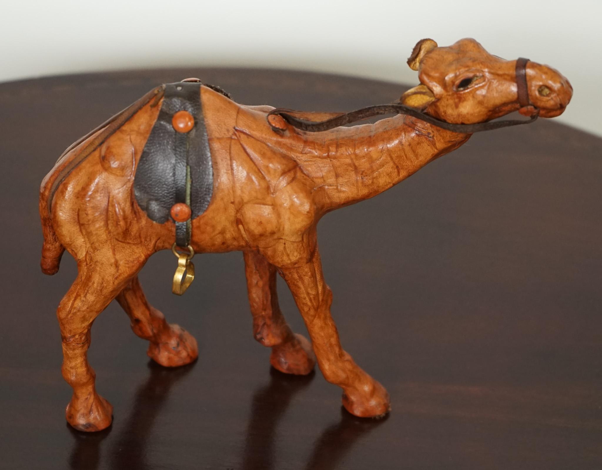 LIBERTY'S LONDON CAMEL SCULPTURE WiTH LOVELY AGED LEATHER ON HAND CARVED WOOD  In Good Condition For Sale In Pulborough, GB