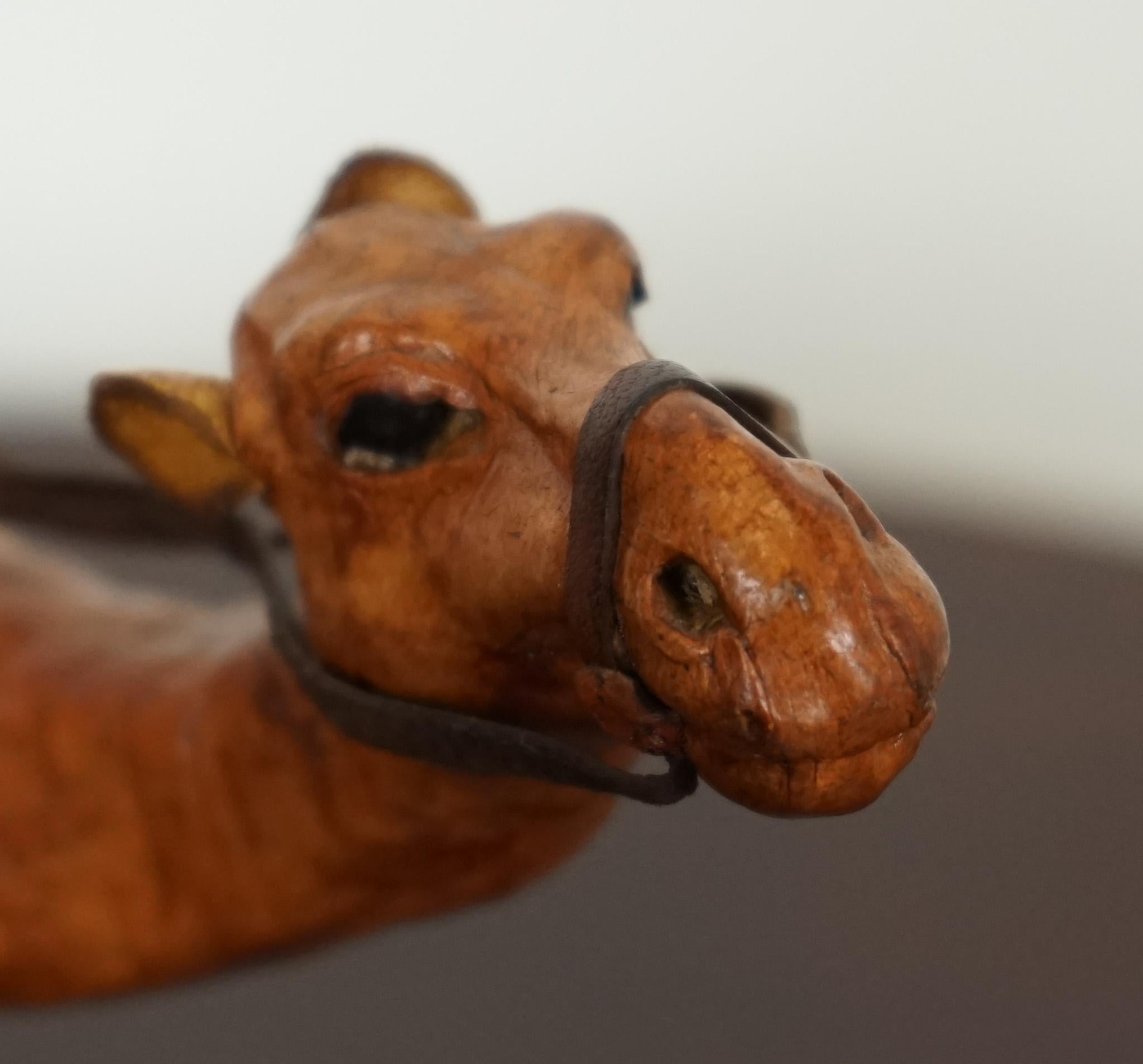 20th Century LIBERTY'S LONDON CAMEL SCULPTURE WiTH LOVELY AGED LEATHER ON HAND CARVED WOOD  For Sale