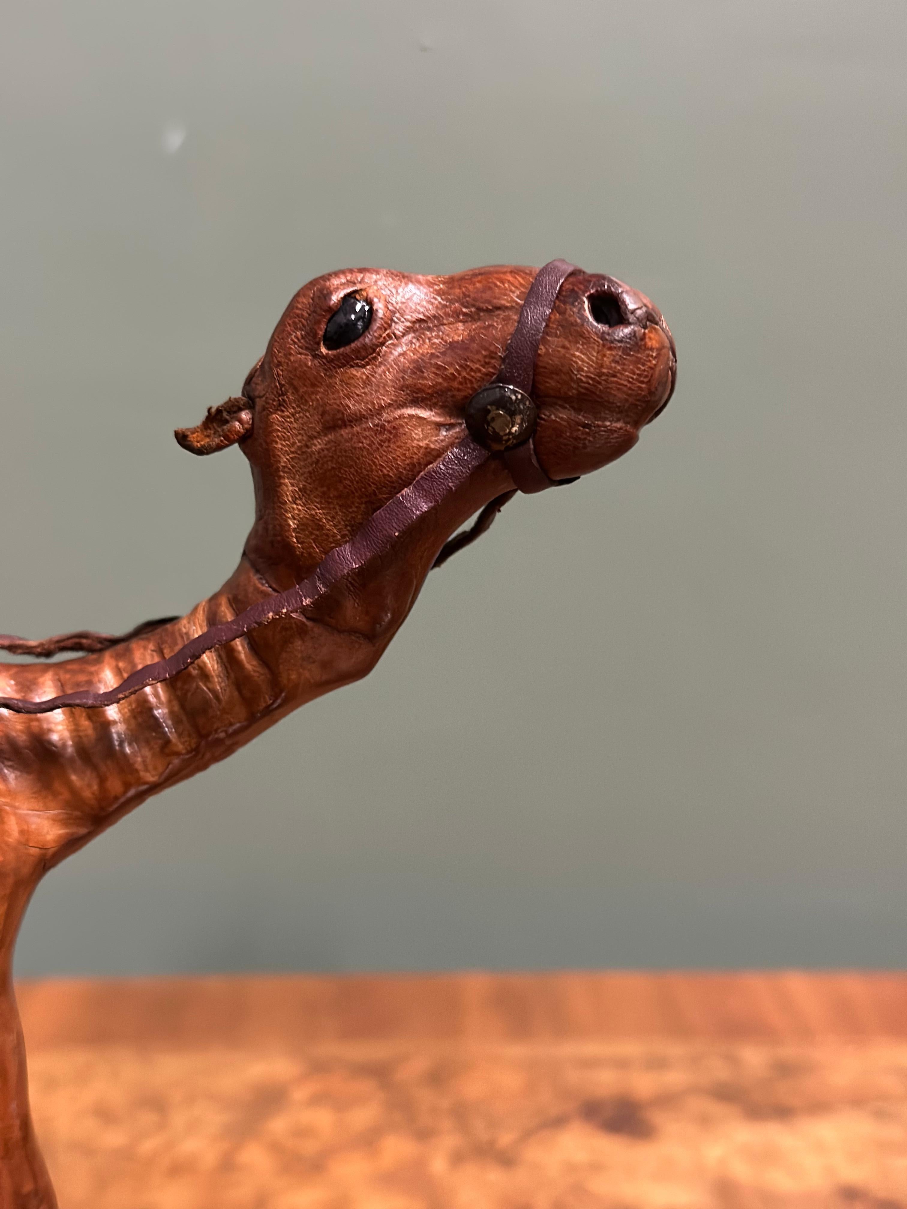 Leather LIBERTY'S LONDON CAMEL SCULPTURE WiTH LOVELY AGED LEATHER ON HAND CARVED WOOD  For Sale