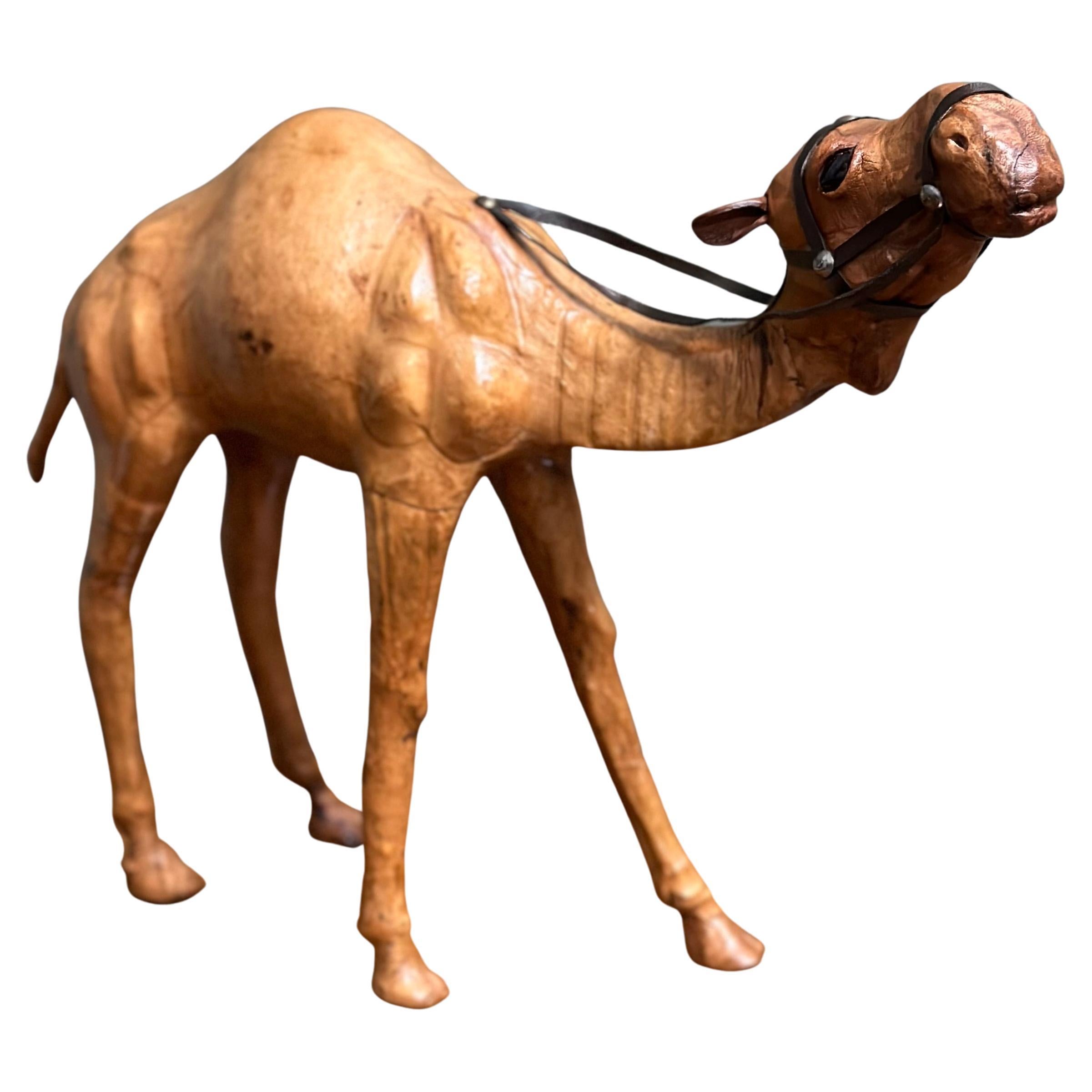 Liberty's London Camel Sculpture with Lovely Aged Leather on Hand Carved Wood For Sale