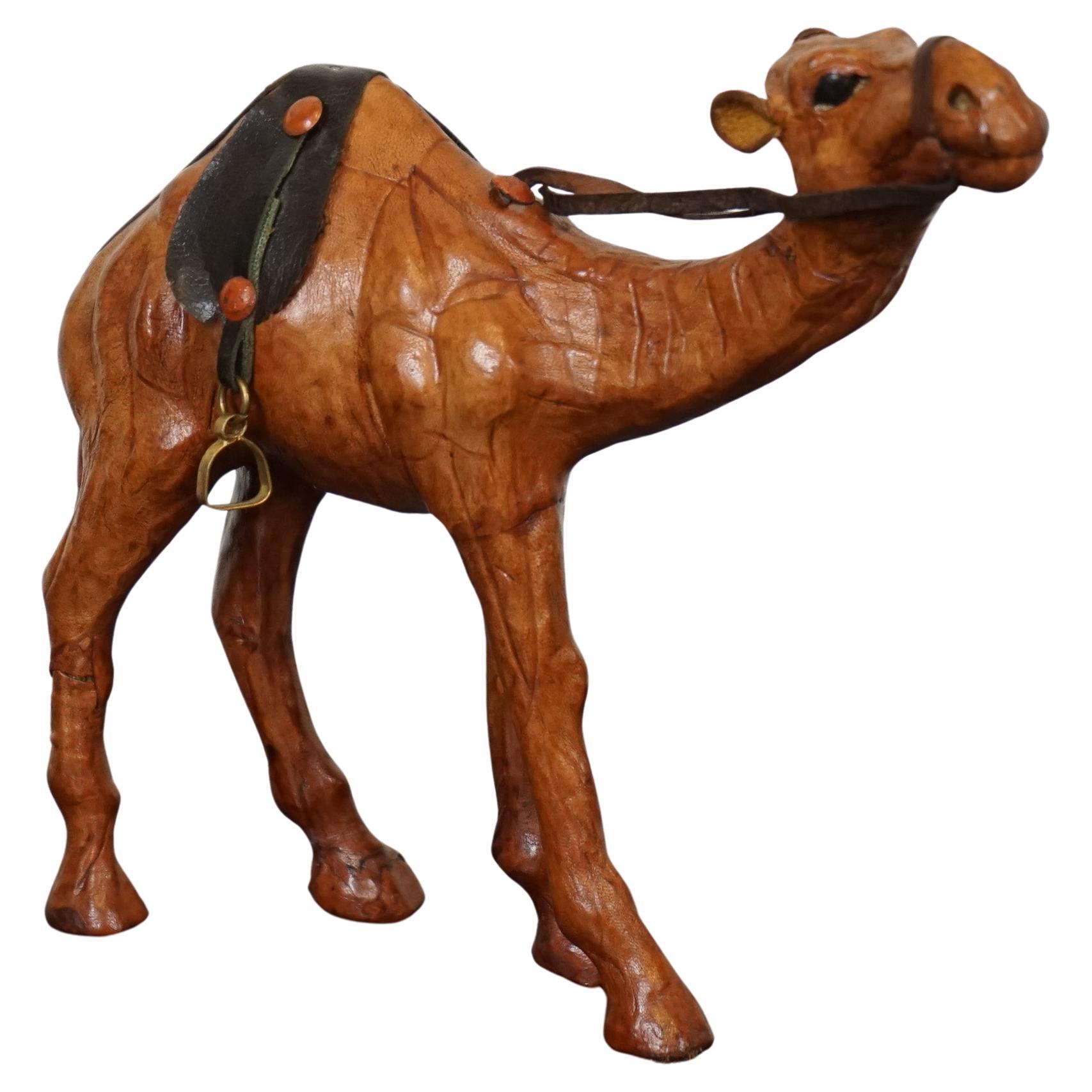 LIBERTY'S LONDON CAMEL SCULPTURE WiTH LOVELY AGED LEATHER ON HAND CARVED WOOD  For Sale