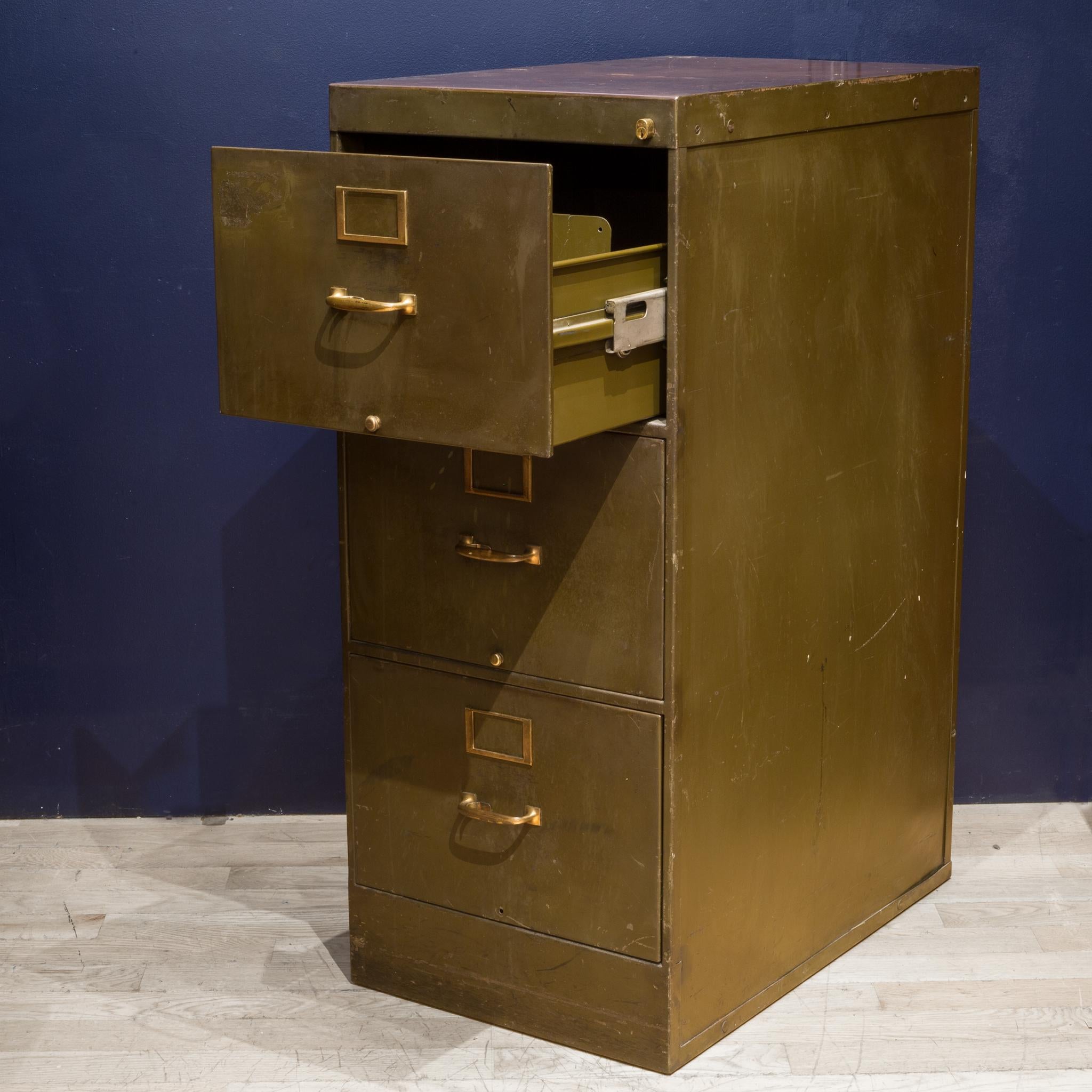 About

An antique army green steel file cabinet with three drawers and rich brown linoleum top. Each drawer has a divider that slides smoothly. Each handle has a unique release lever that unlocks the drawers. The handles, name plates and locks are