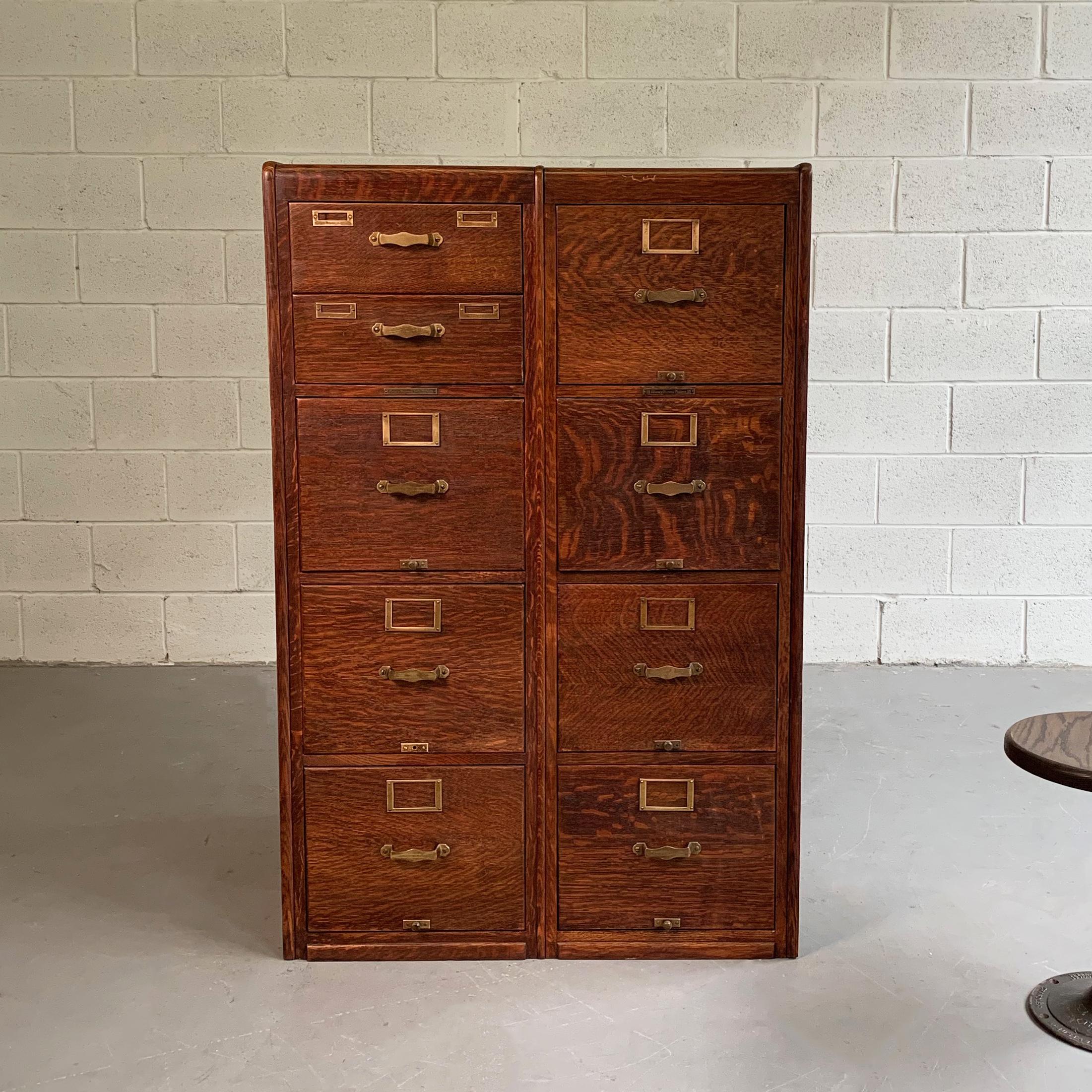 Early 20th century, Industrial, quarter sawn oak, file cabinet by Library Bureau SoleMakers features brass pulls and label plates on nine 14 inch wide drawers, finished panel detail on the sides and back and rounded edges. Seven drawers can