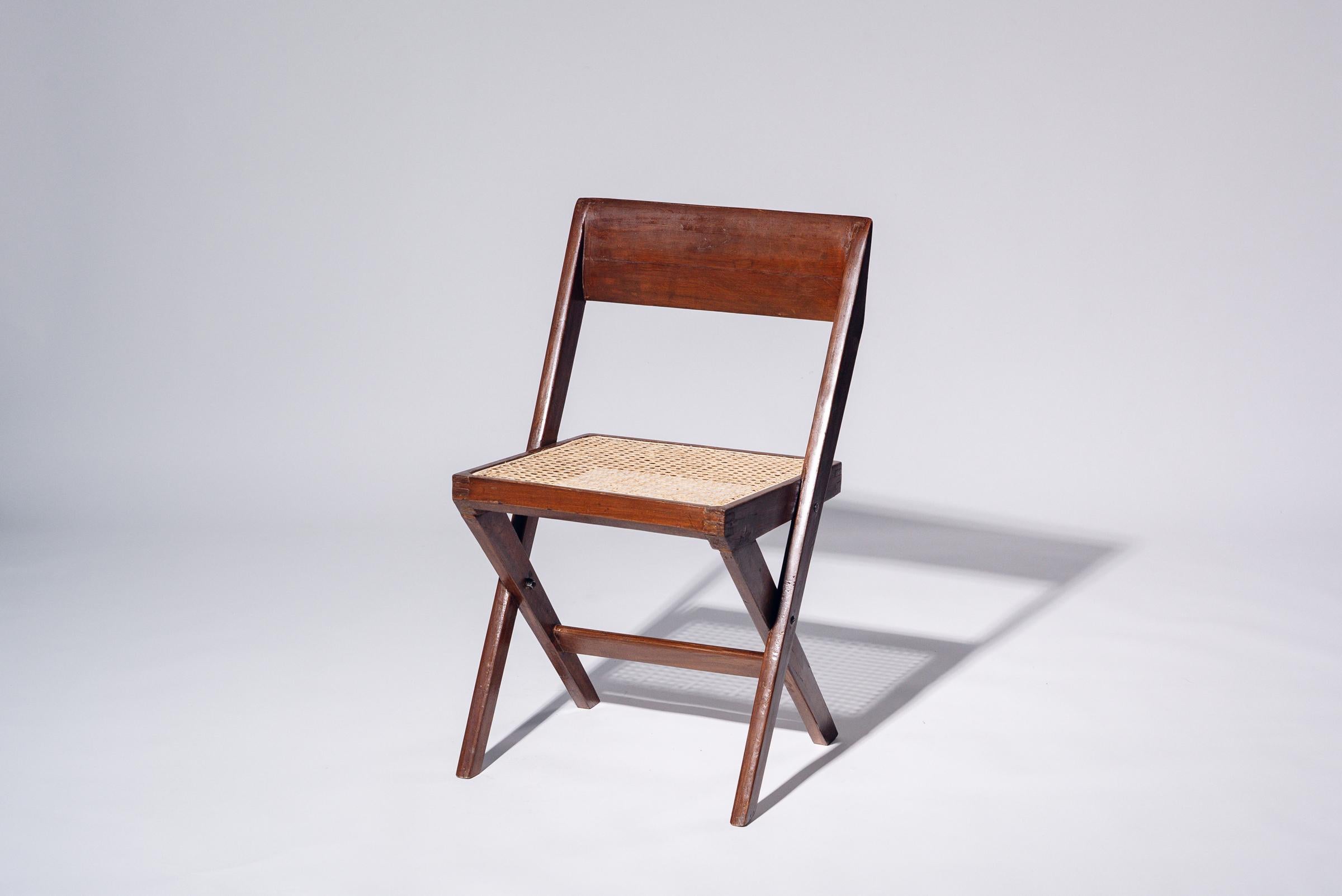 An authentic mid-century piece from Pierre Jeanneret’s legendary Chandigarh commission. Teak frame with hand-woven bamboo-rattan seat.