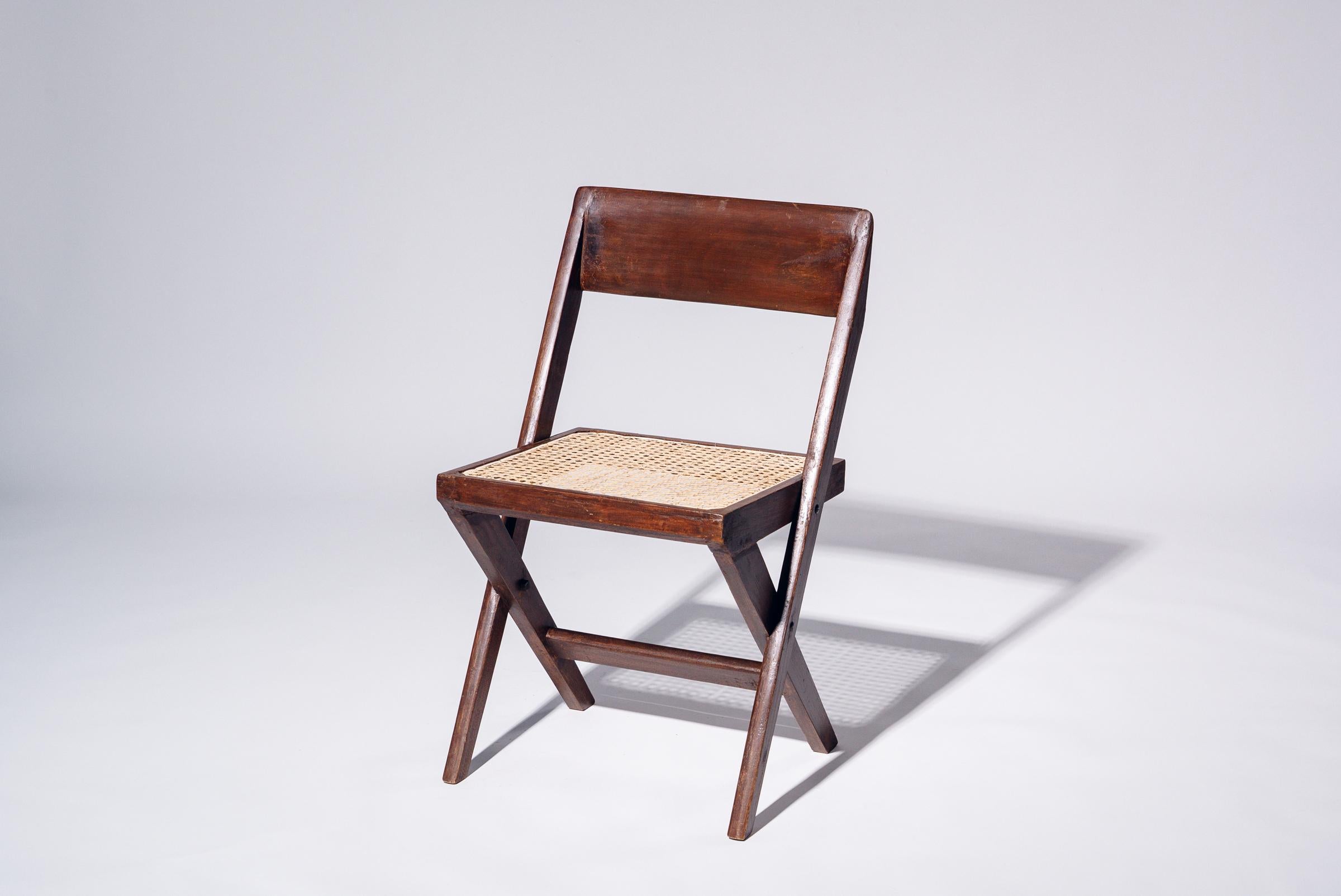 An authentic mid-century piece from Pierre Jeanneret’s legendary Chandigarh commission. Teak frame with hand-woven bamboo-rattan seat.