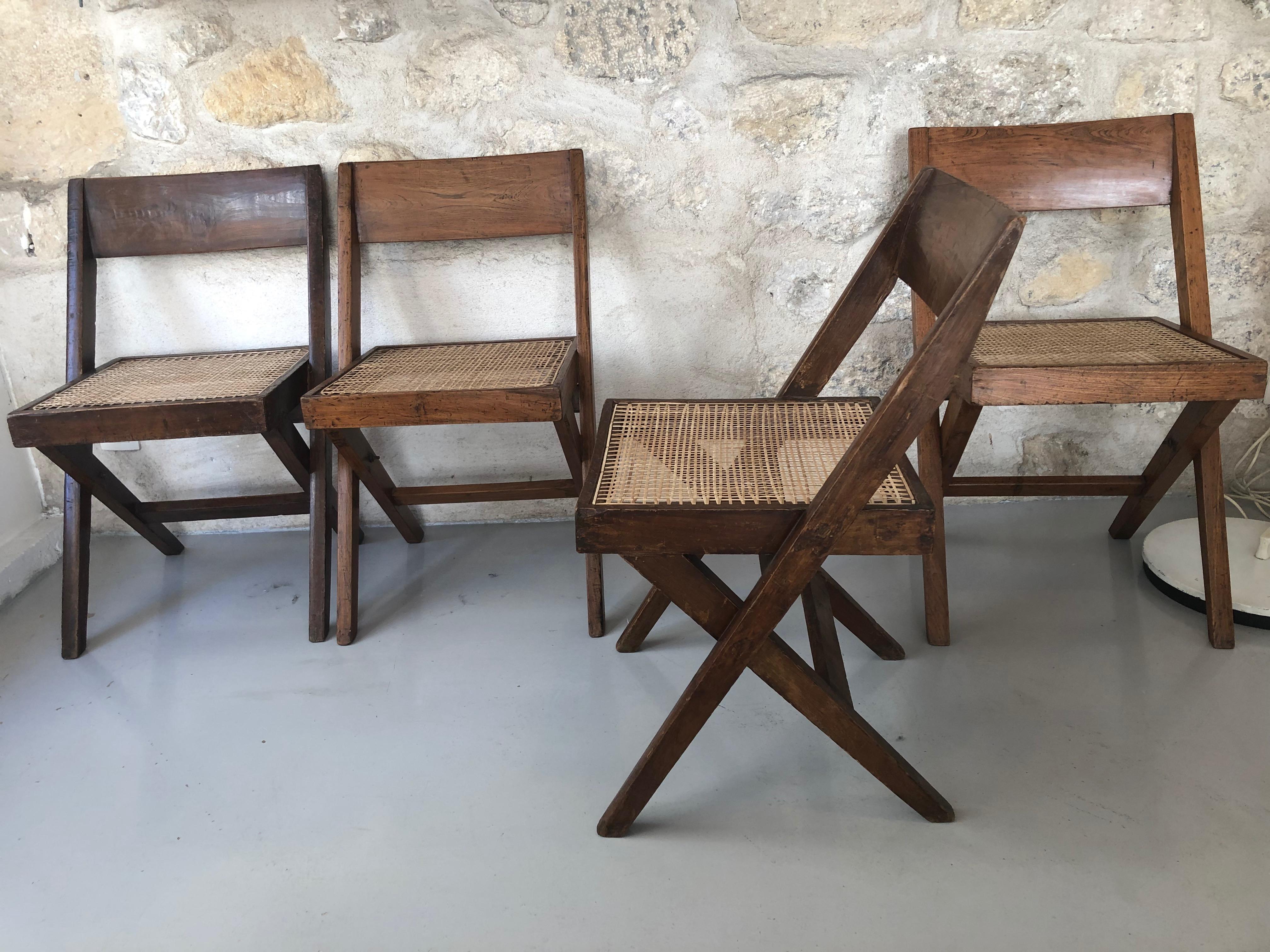 Set of 4 chairs «Library» by Pierre Jeanneret made for the Central Library of Punjab University in Chandigarh.
Solid teak chair with cane seat.