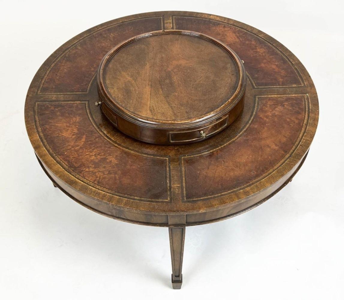 A Rare Coffee table Probably Made By Theodore Alexander
This Table Dates From Late C20th century
Quite unique Due to the Lazy Susan in The Middle and Leather Borders.