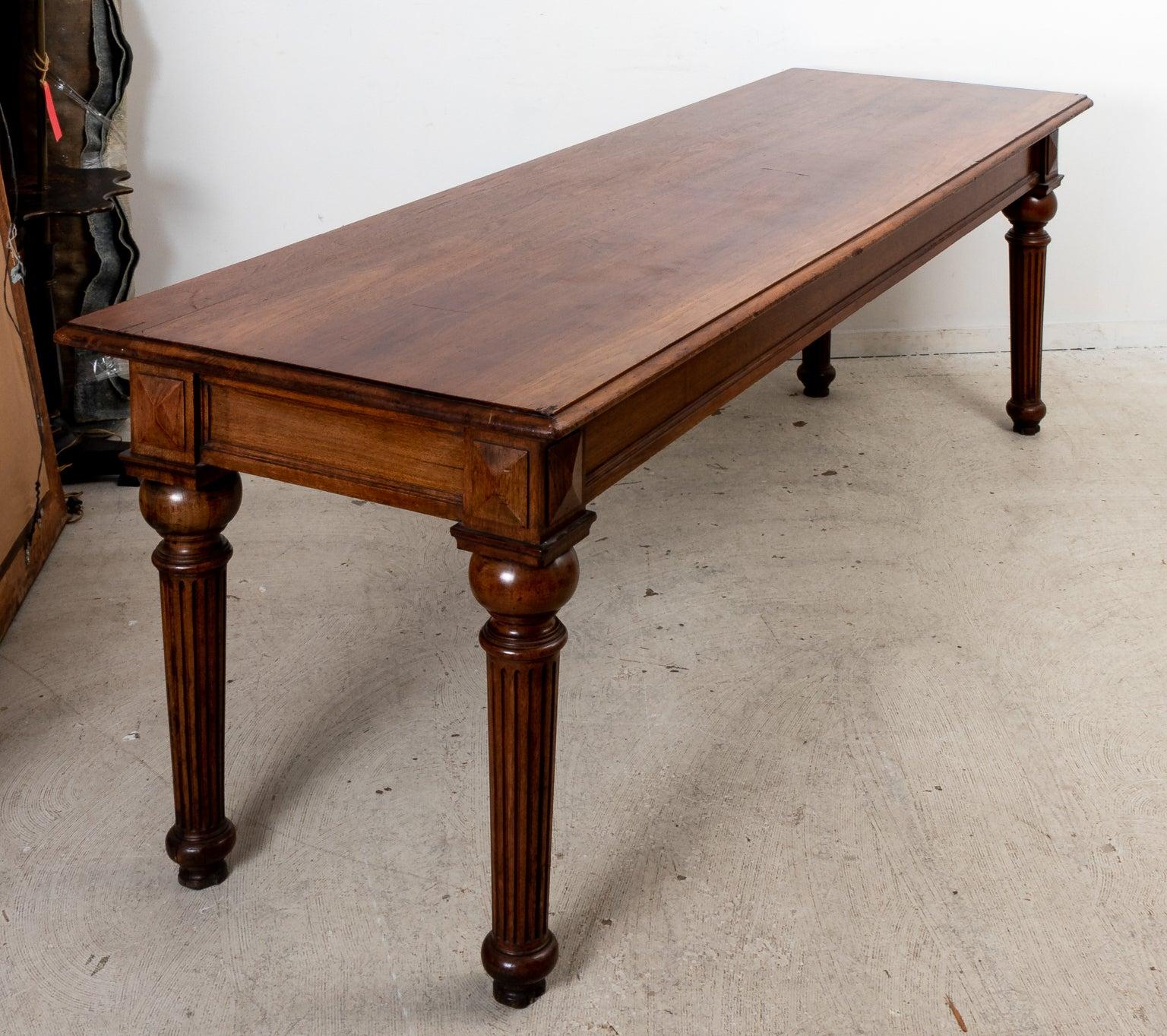 Mahogany Library table with turned fluted legs. Please note of wear consistent with age.