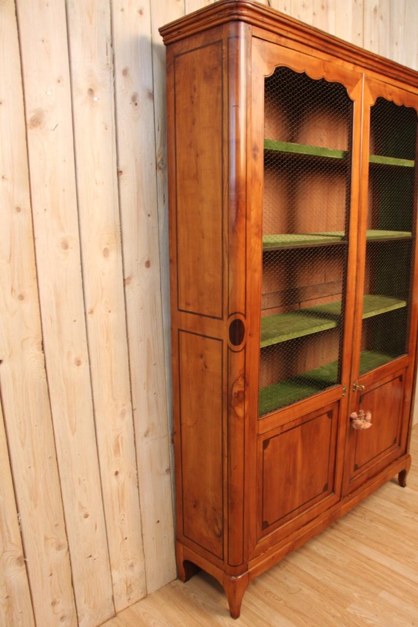 bookcase in cherry wood and walnut fillets, in very good condition.