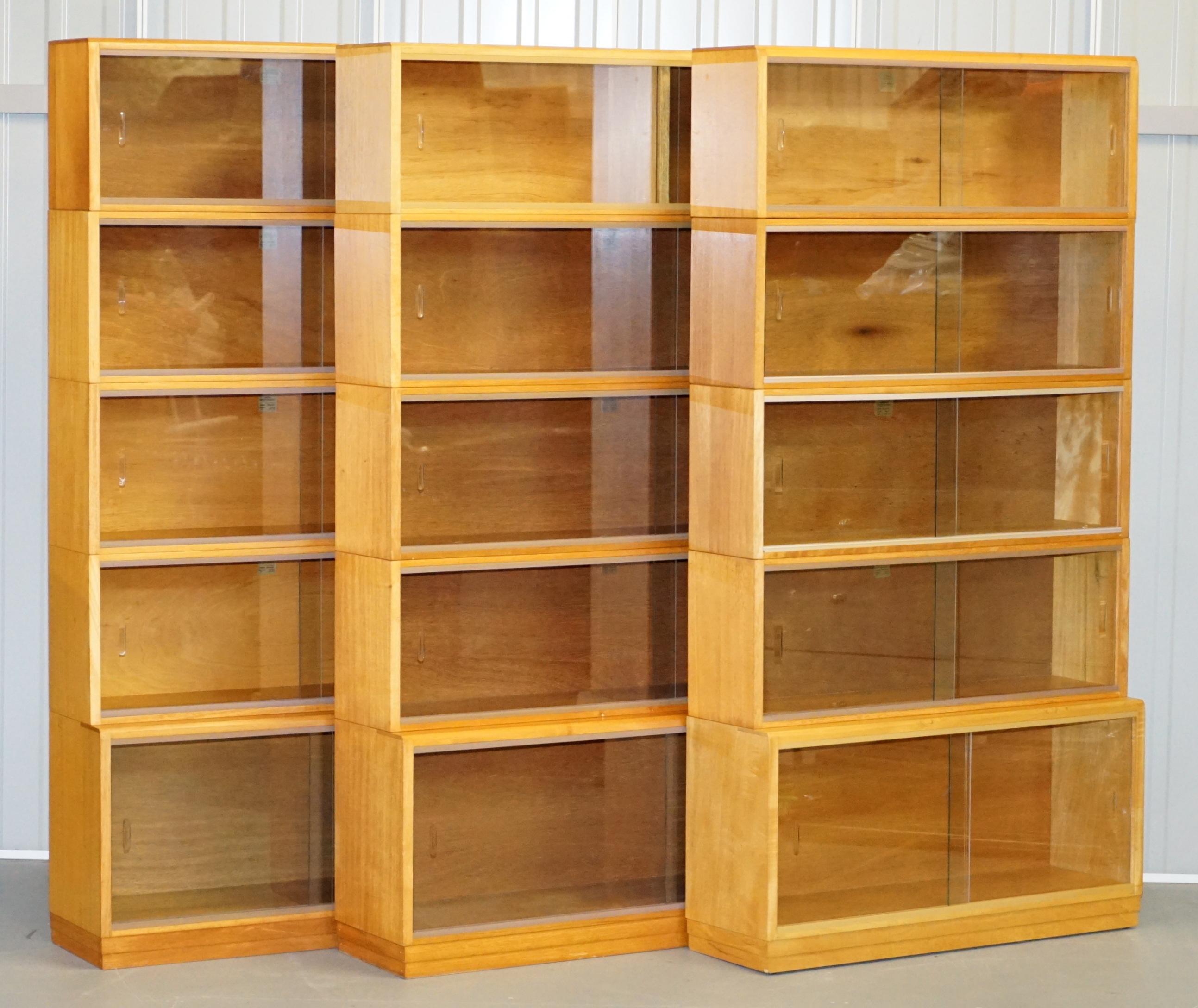We are delighted to offer for sale this stunning suite of three simplex golden light oak Library Legal bookcases with glass sliding doors

A very good looking well made and highly collectable set of library bookcase. The total width is 305cm so