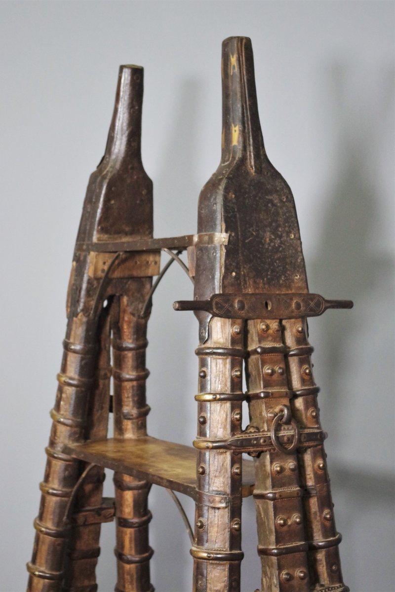 Antique Teak Wood and Brass Bookcase - India, Rajasthan, Early 1900s

This stunningly beautiful piece of extraordinary workmanship is a bookcase made from an ancient Indian camel wagon, originally from the Rajasthan region. Made entirely of fine