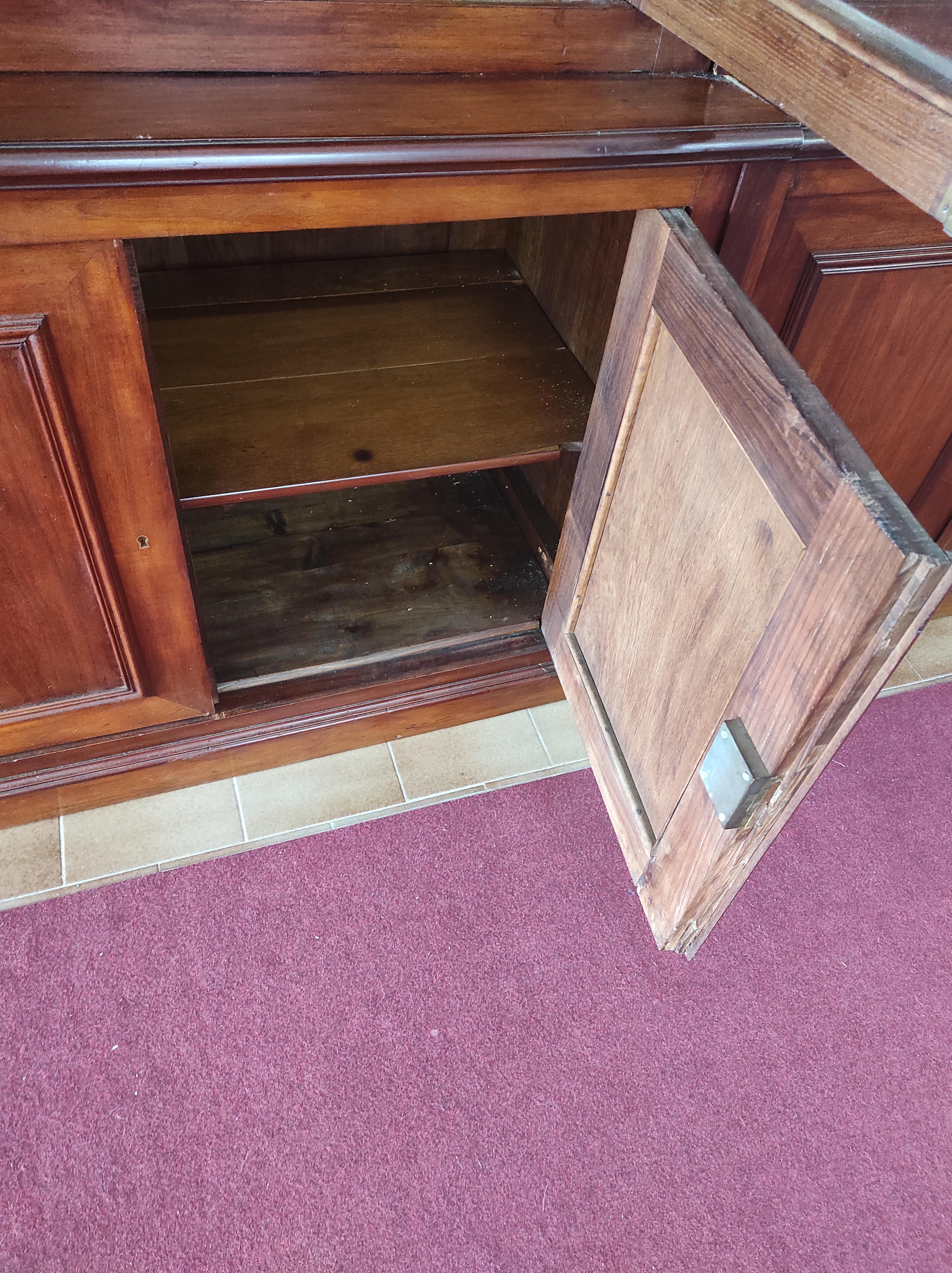 Bookcase with 6 doors above and 6 doors below made of mahogany wood and fir interior and backs.
The provenance is France year of production 1890 
The inside of the bookcase is shelved both underneath and on the top.
The top is glazed and the