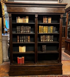 Solid walnut bookcase, carved, with columns, Italy