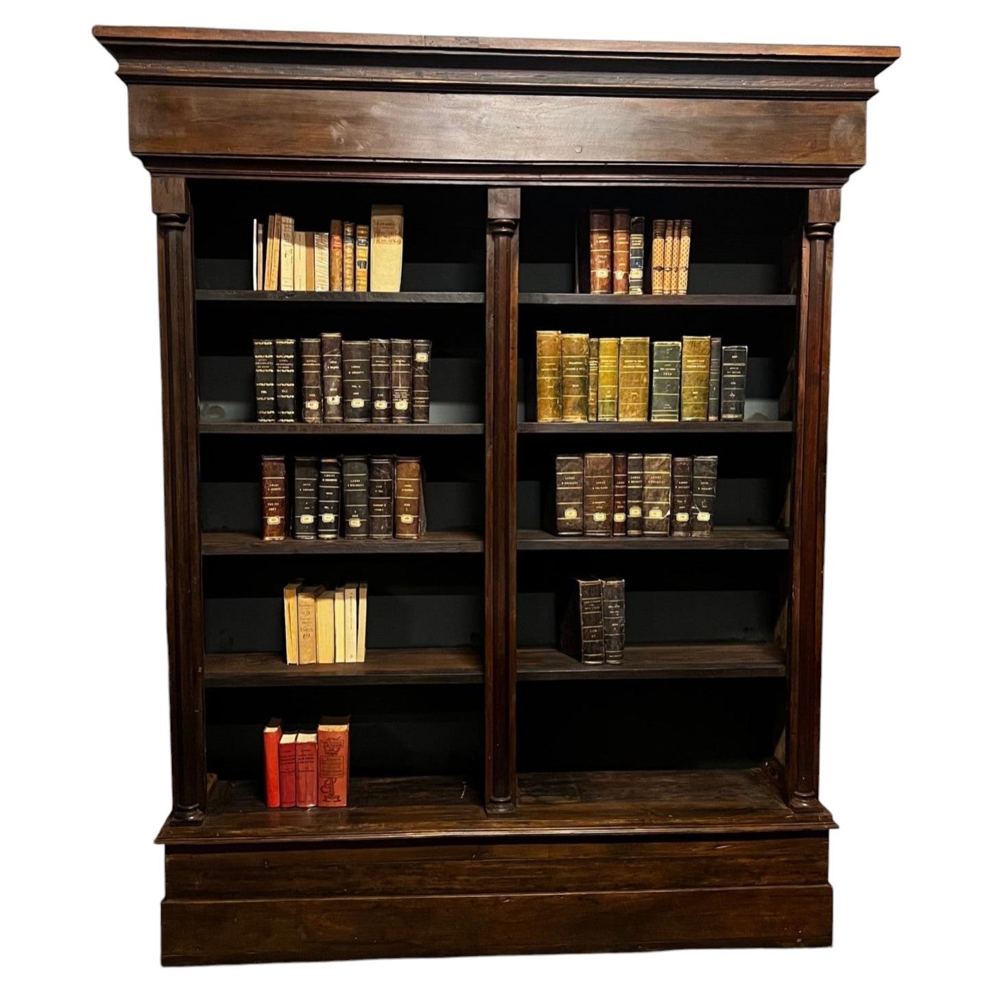 Solid walnut bookcase, carved, with columns, Italy