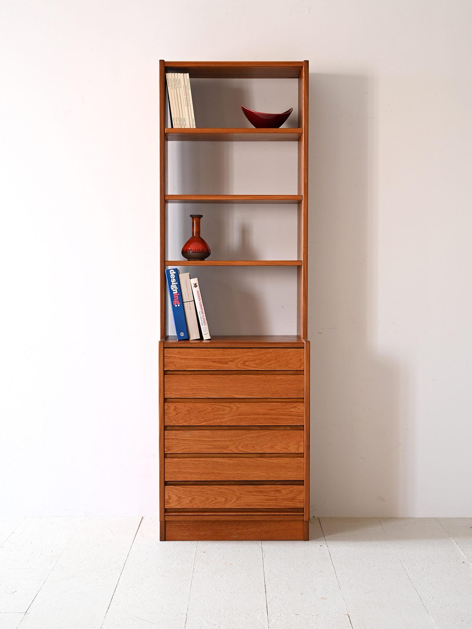 Vintage Scandinavian chest of drawers with shelving.

Featuring six drawers that provide ample space to carefully organize personal items, it has open shelves that invite the arrangement of books and art objects. The teak finish, with its expressive