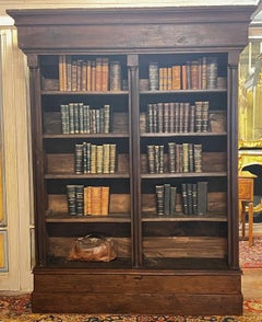 Neoclassical carved walnut bookcase with columns, Italy