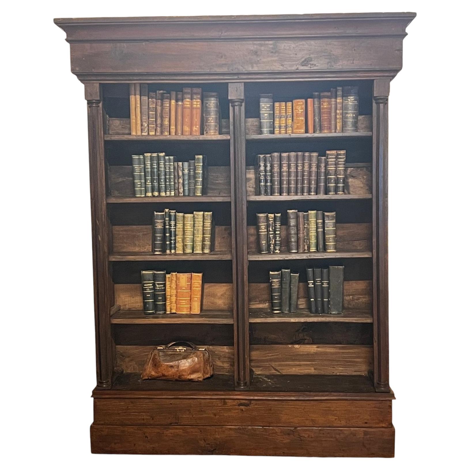 Neoclassical carved walnut bookcase with columns, Italy