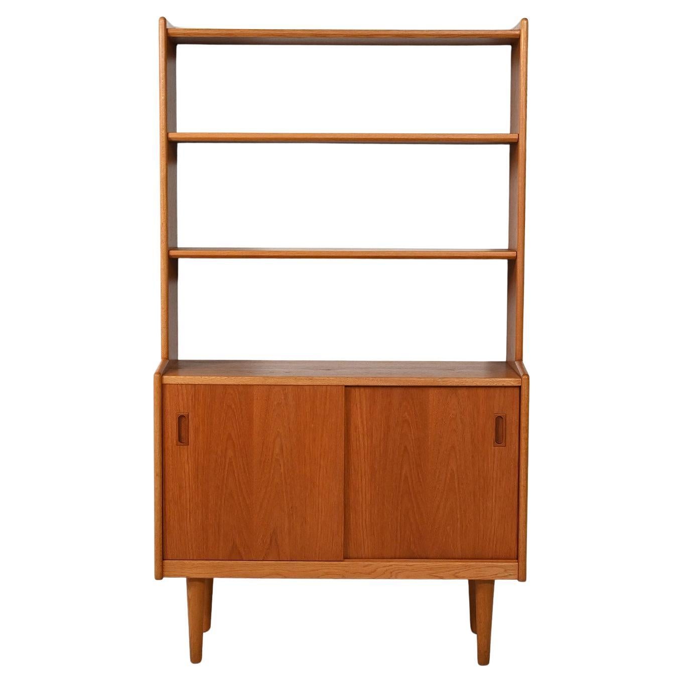 Scandinavian 1960s teak bookcase with storage compartment