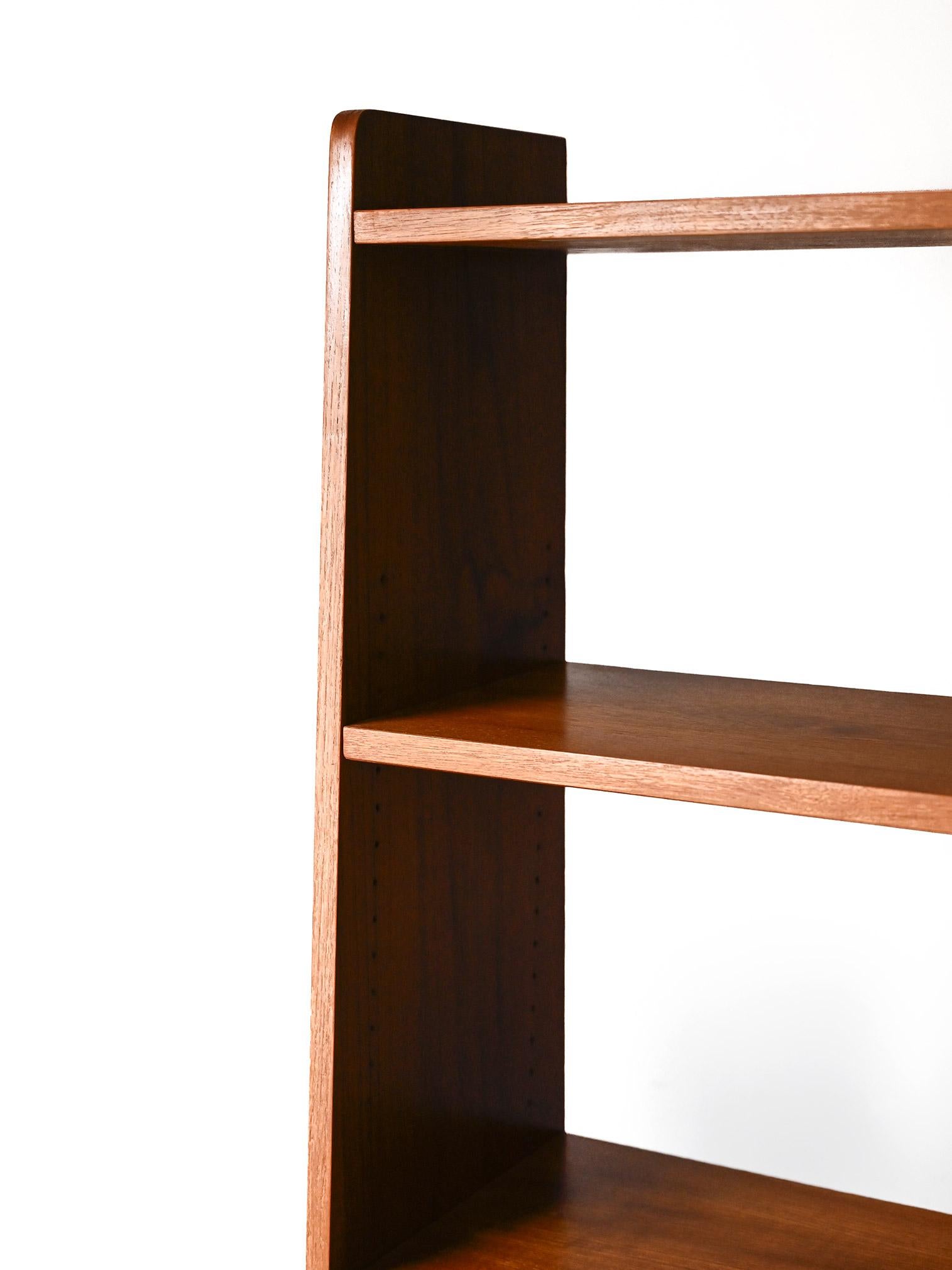 Mid-20th Century Scandinavian teak bookcase with black bottom For Sale