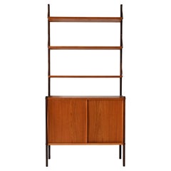 Vintage Scandinavian bookcase with exposed shelves and brass pulls