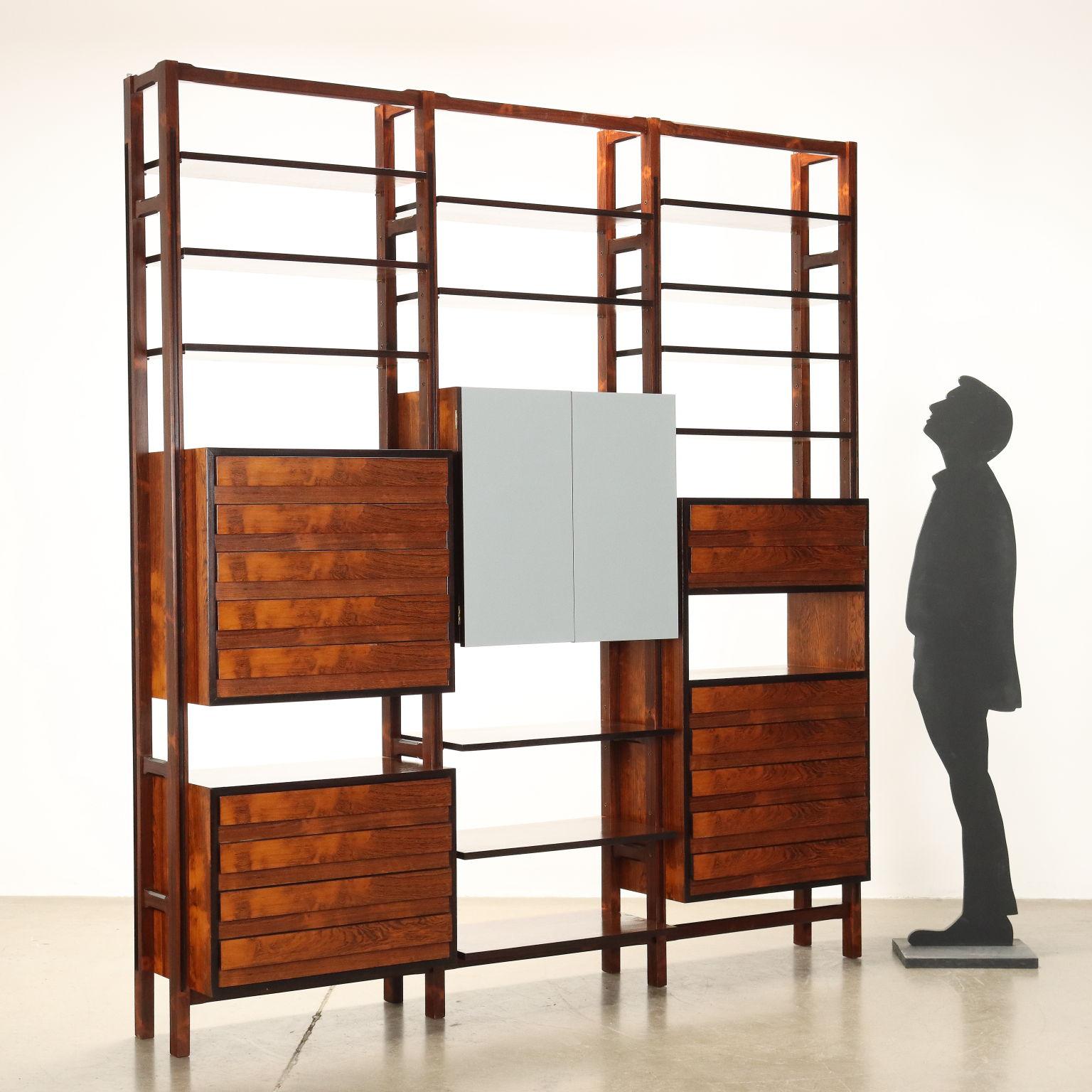 Storage element bookcase with exposed drawers and central body with hinged doors, solid wood and Jacaranda wood veneer. Formica-covered doors. Restaurata.