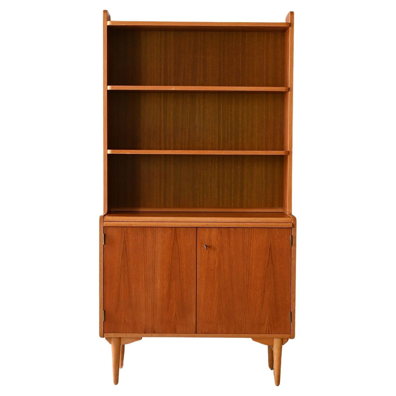Vintage bookcase with pull-out shelf For Sale