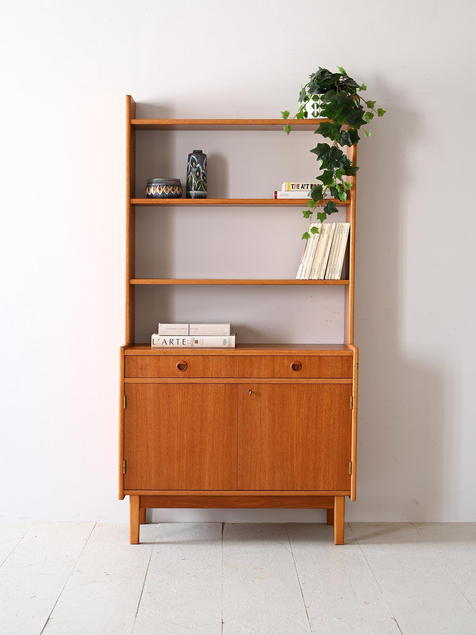 Scandinavian 1960s teak and birch furniture.

This cabinet with built-in bookcase, created in the midst of the Scandinavian style of the 1960s, combines the functionality of an enclosed storage compartment with the aesthetics of an open display