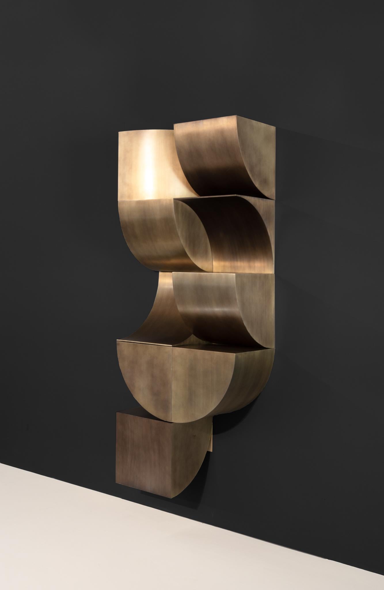Librero Duna 1 by Eliana Portilla
Dimensions: D 35 x W 70 x H 175 cm.
Materials: Steel with brass coat.

This shelf is made of nine modular pieces. Please contact us.

I’m inspired by the balance, asthetics, color and space of geometrics. Always