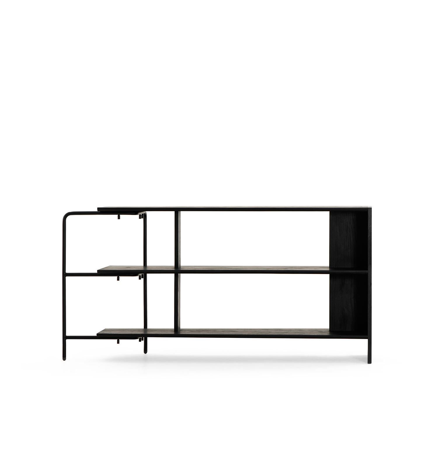 It belongs to the exclusive line of Cuchara, showcasing the highest quality materials and exquisite craftsmanship. With its unique blend of black electro-painted carbon steel and solid wood, this bookcase stands out as a stunning piece of