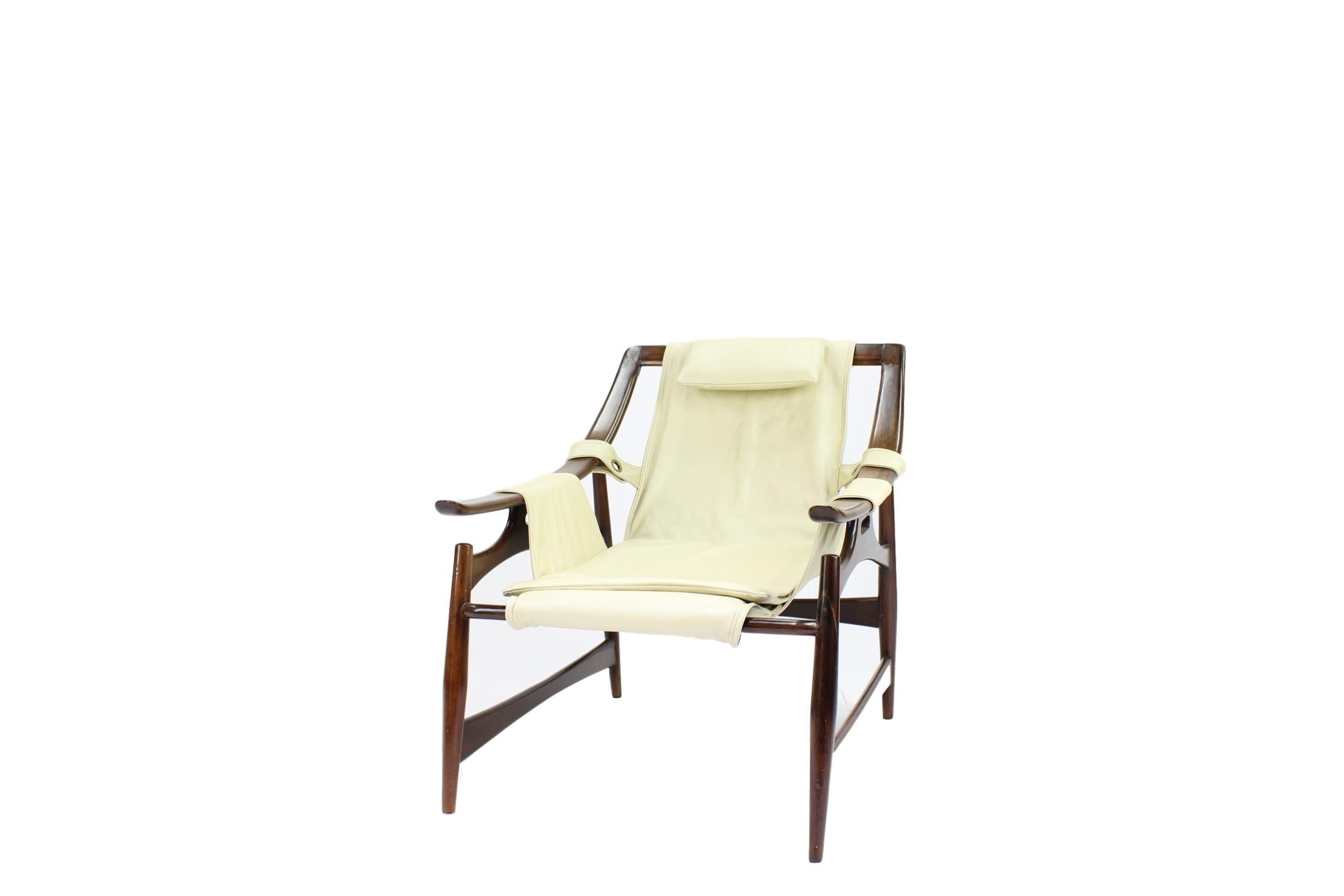 Liceu de Artes e Ofiicios, lounge chair, Brazil, 1960s.

The construction of the frame is created according to a skeleton layout. The design holds an open character with admiring lines and curves. The seating consists of dark brown suede, which