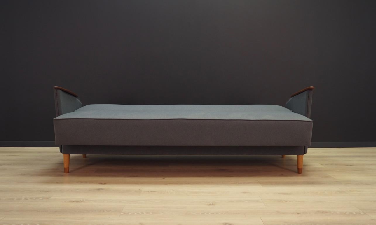 Fantastic sofa from the 1960-1970. Scandinavian design, Minimalist form. Manufactured in Lico System. Upholstery after replacement made of grey fabric, with great teak armrests. Maintained in good condition, directly for use.

Dimensions: Height