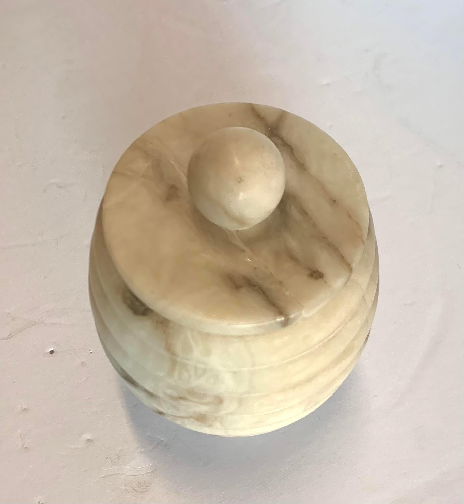 Italian lidded alabaster jar with ribbed decorative detailing.
Can be combined with several others to make a gradated set.
Lid has been repaired.