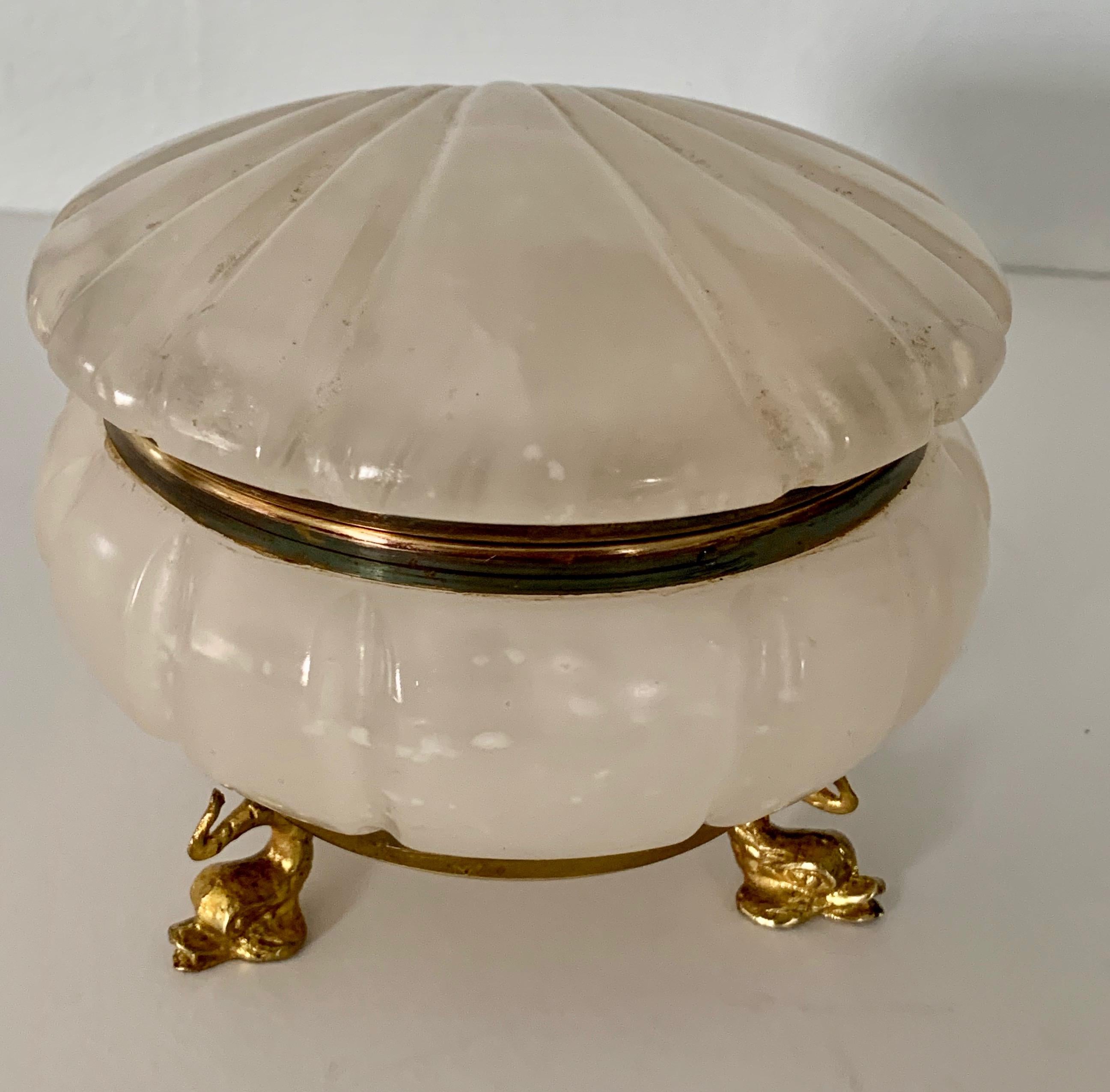 Lidded Alabaster shell box with dolphin feet - compliment to the vanity or dressing table... holding change, jewelry, or make-up accessories. The gold dolphin feet are a wonderful detail on this piece.