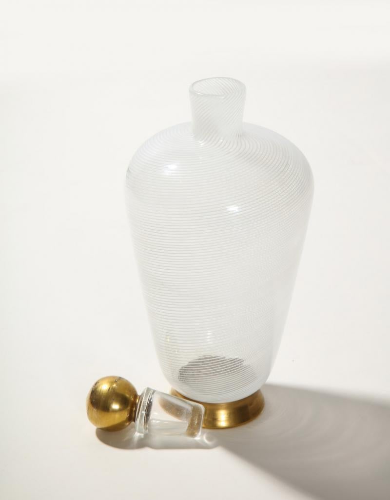 Lattimo glass, clear and white with gold painted foot to both pieces. Designed by Buzzi in 1932 and presented at the 18th Venice Biennale also in 1932. Published: Tomaso Buzzi at Venini. Pg 100, 101, 106, 107.
   