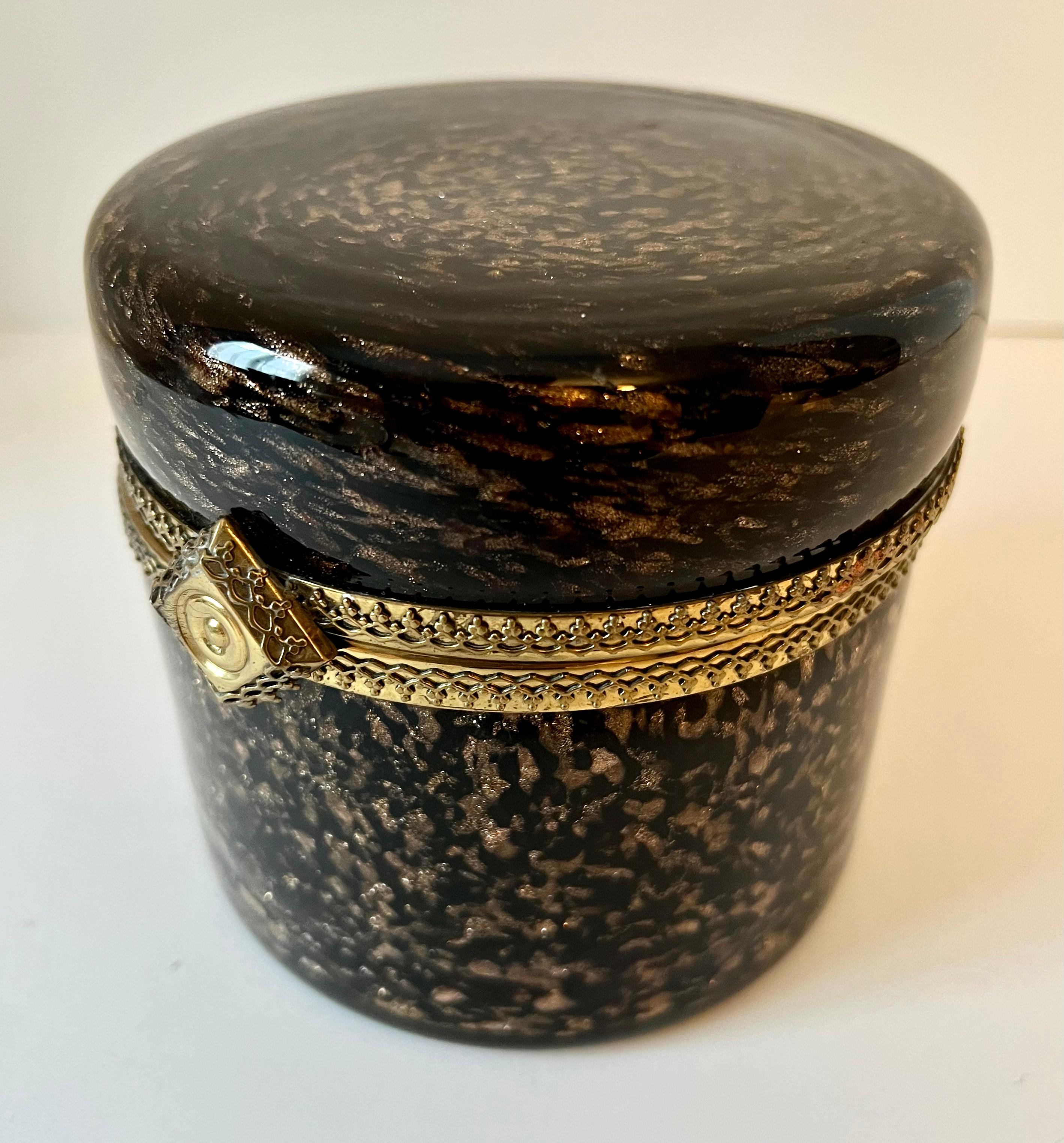 A stunning Murano glass hinged top box with a tortoise style glass design and gold shimmering flecks. The piece is a compliment to any vanity or dressing table, bathroom. Could also be used in the main room or even bar. a wonderfully sophisticated