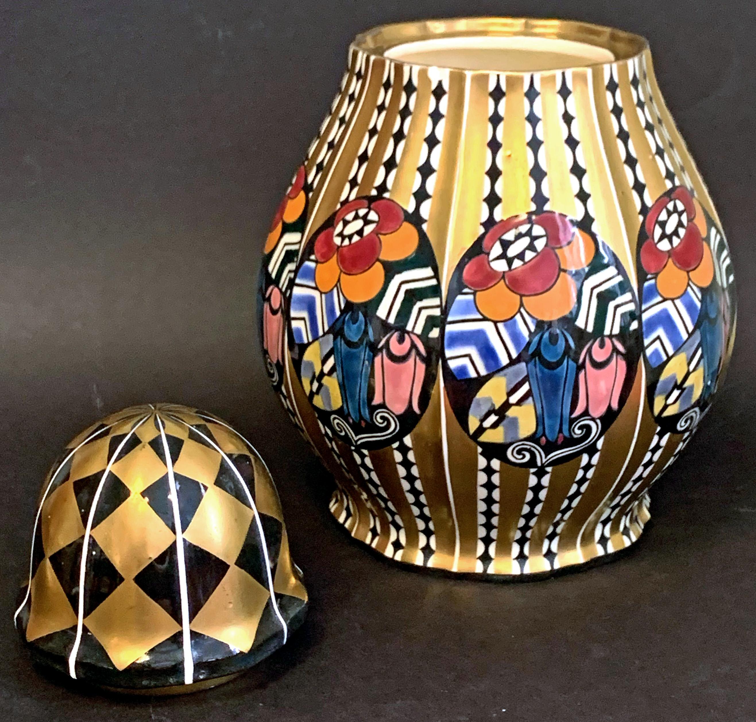 Spectacularly designed and executed, this rare ceramic lidded urn or vase enriched with a complex interplay of geometric and floral motifs was designed by Austrian architect Emanuel Josef Margold for the famed Wahliss Serapis ceramics line. The rich