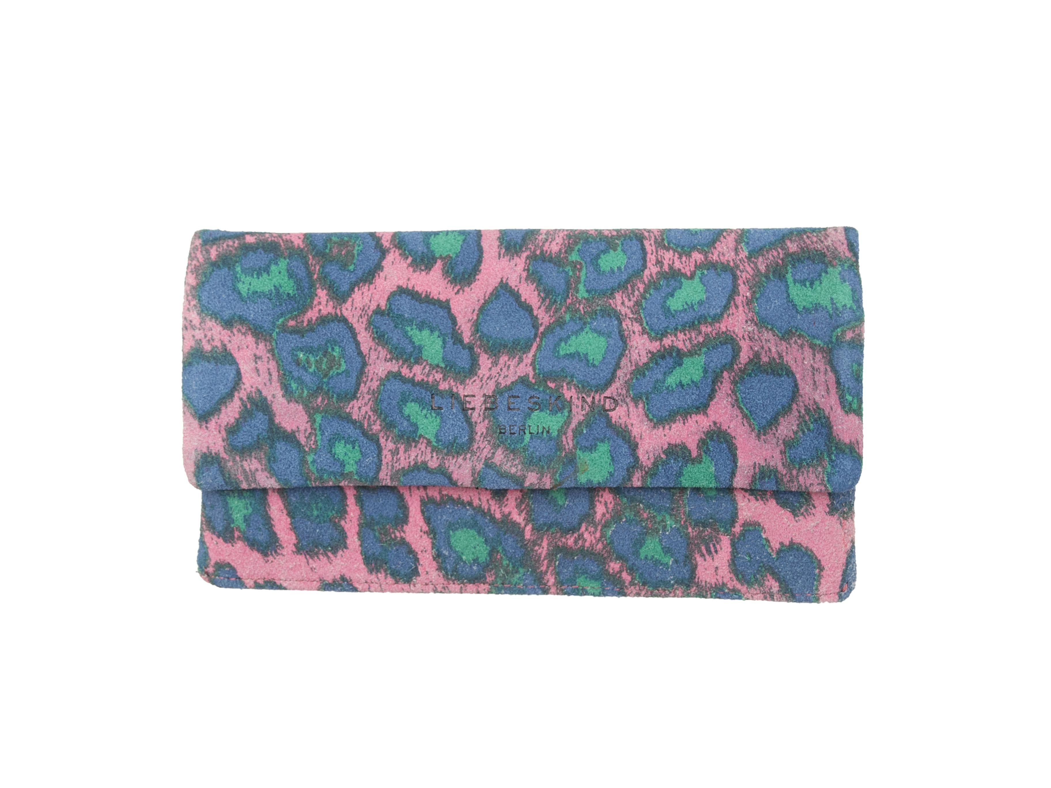 Product details: Light pink, blue, and teal leopard print suede continental wallet by Liebeskind. Exterior back zip pocket. Interior card and cash slots. Snap closure at front flap. 1