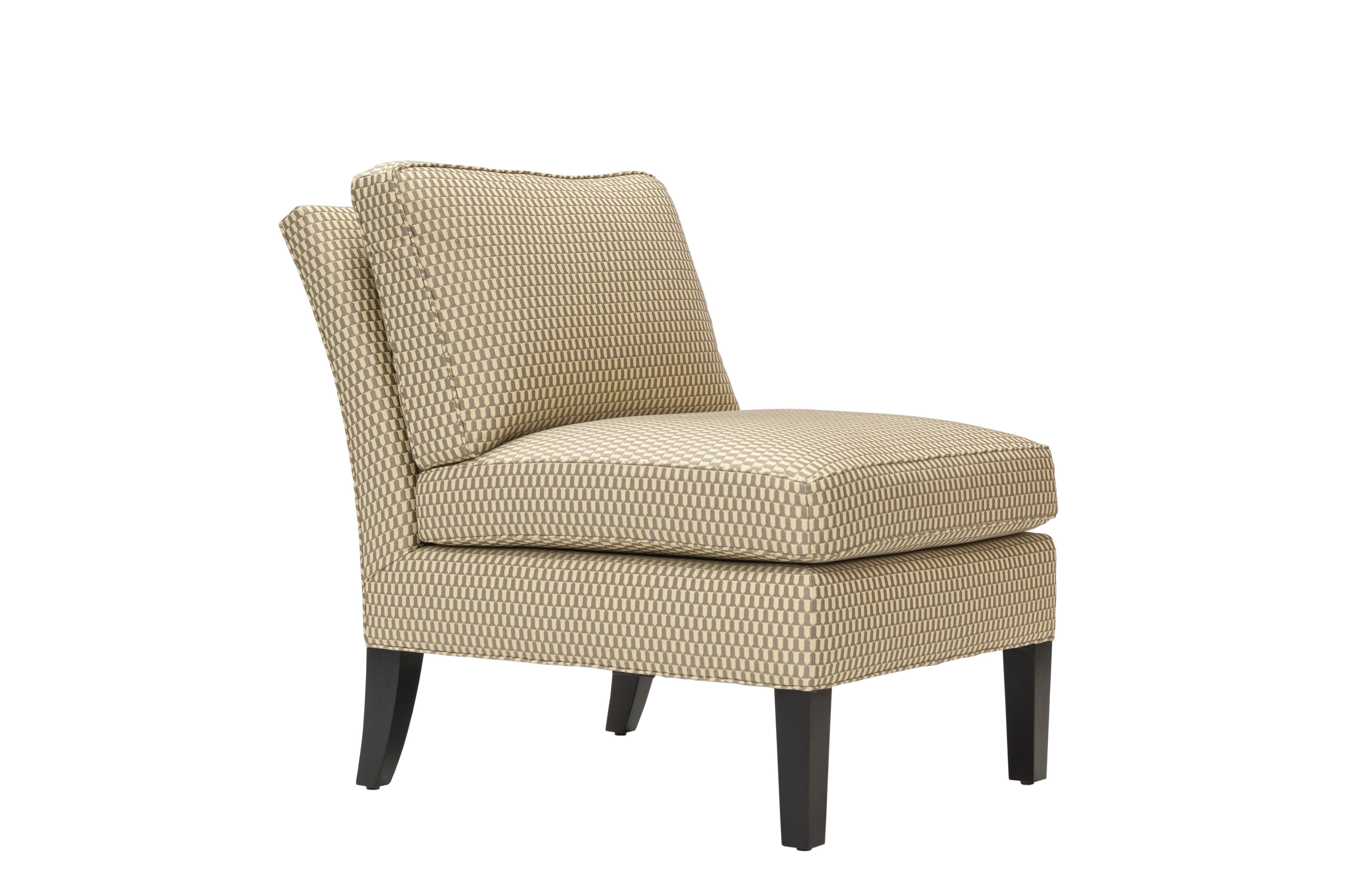 The Liesel chair has a semi-attached back cushion and loose seat cushion. Tapered front legs and flared back legs are made of blackened hardwood.

Customer's own material is required for upholstery: 6 yds

Made to order item and hand crafted in the