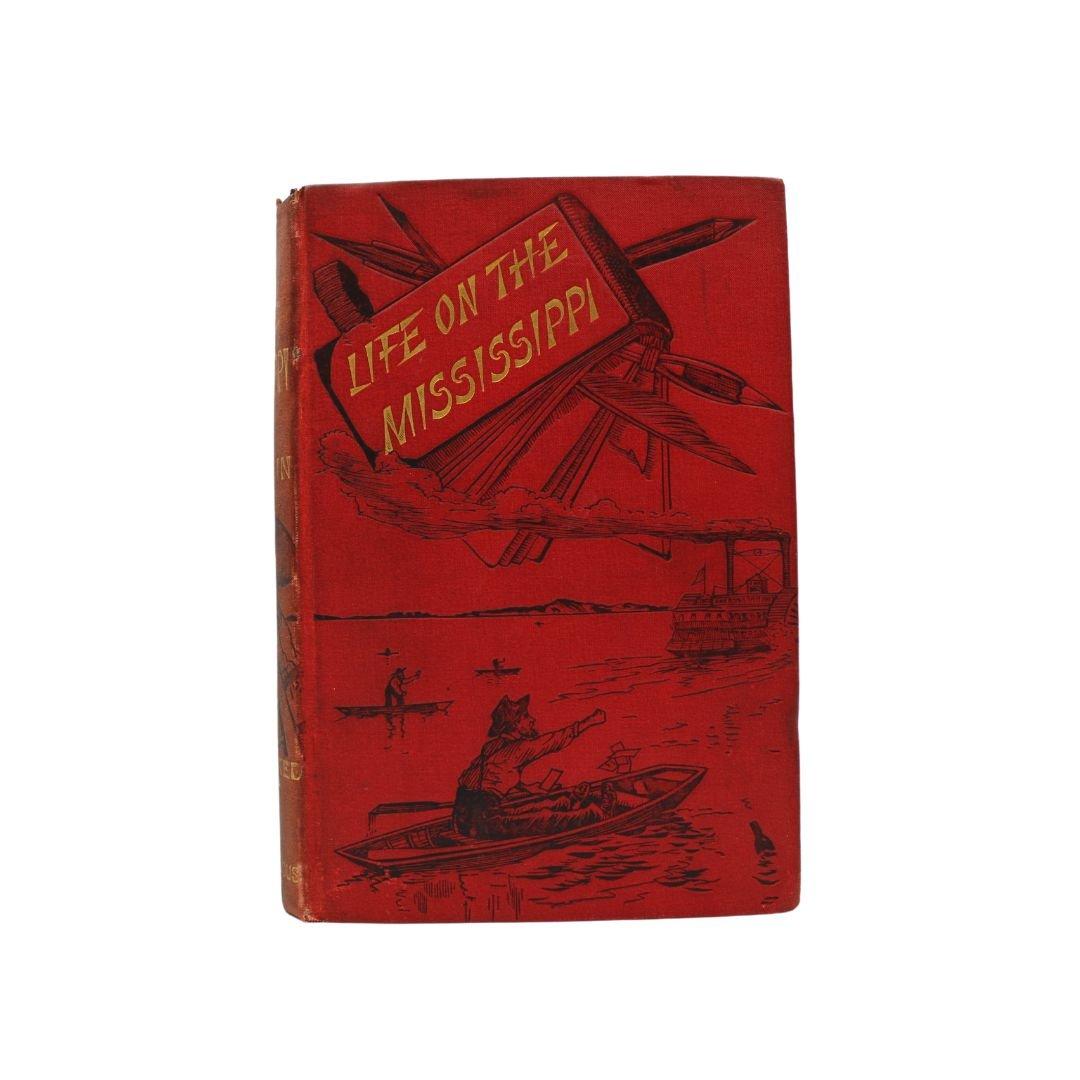 Twain, Mark. La vie sur le Mississippi. Avec plus de 300 illustrations. Londres : Chatto & Windus, 1883. Première édition britannique. 8vo. Carton original en toile rouge picturale, gaufrée en noir et lettrée en doré. Illustré. 
Il s'agit de la
