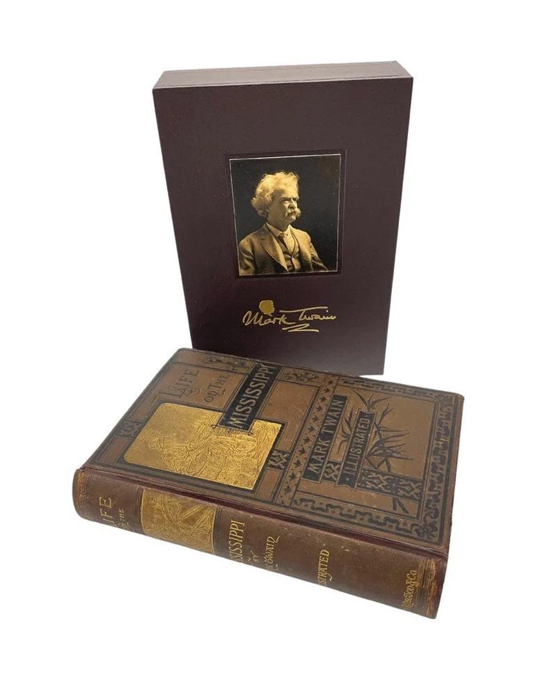 Twain, Mark. Life on the Mississippi. Boston: James R. Osgood and Company, 1883. First edition, second state. Illustrated throughout, with plates and in-text. In publisher’s brown cloth front board and spine stamped in gilt and black. Presented in a