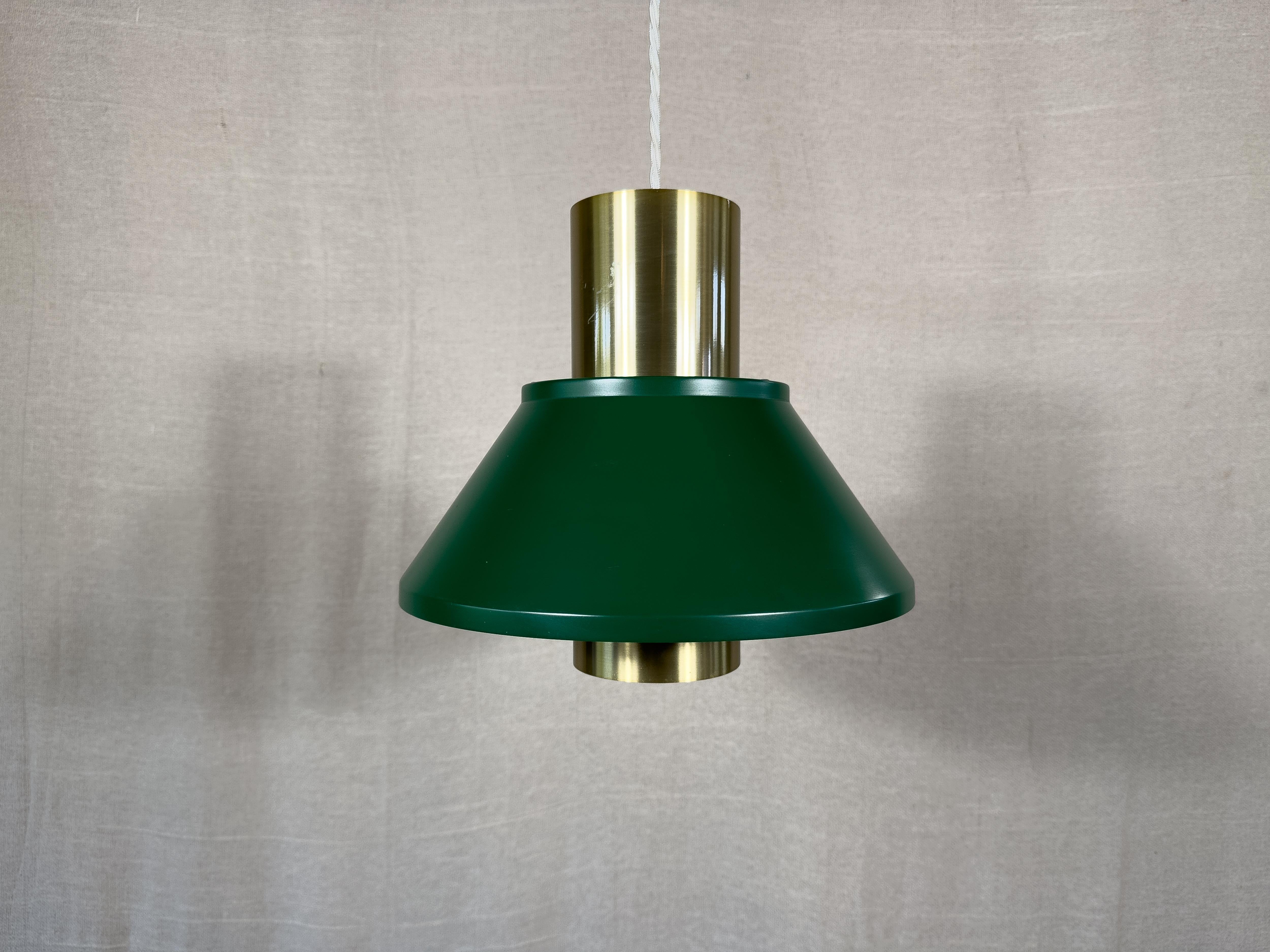 Titled the Life pendant, these gorgeous ceiling lights were designed by Jo Hammerborg for Fog & Mørup in the 1960s. The rich emerald green contrasts the brass accents of the light beautifully, creating a rich and sumtous feel, that is extended