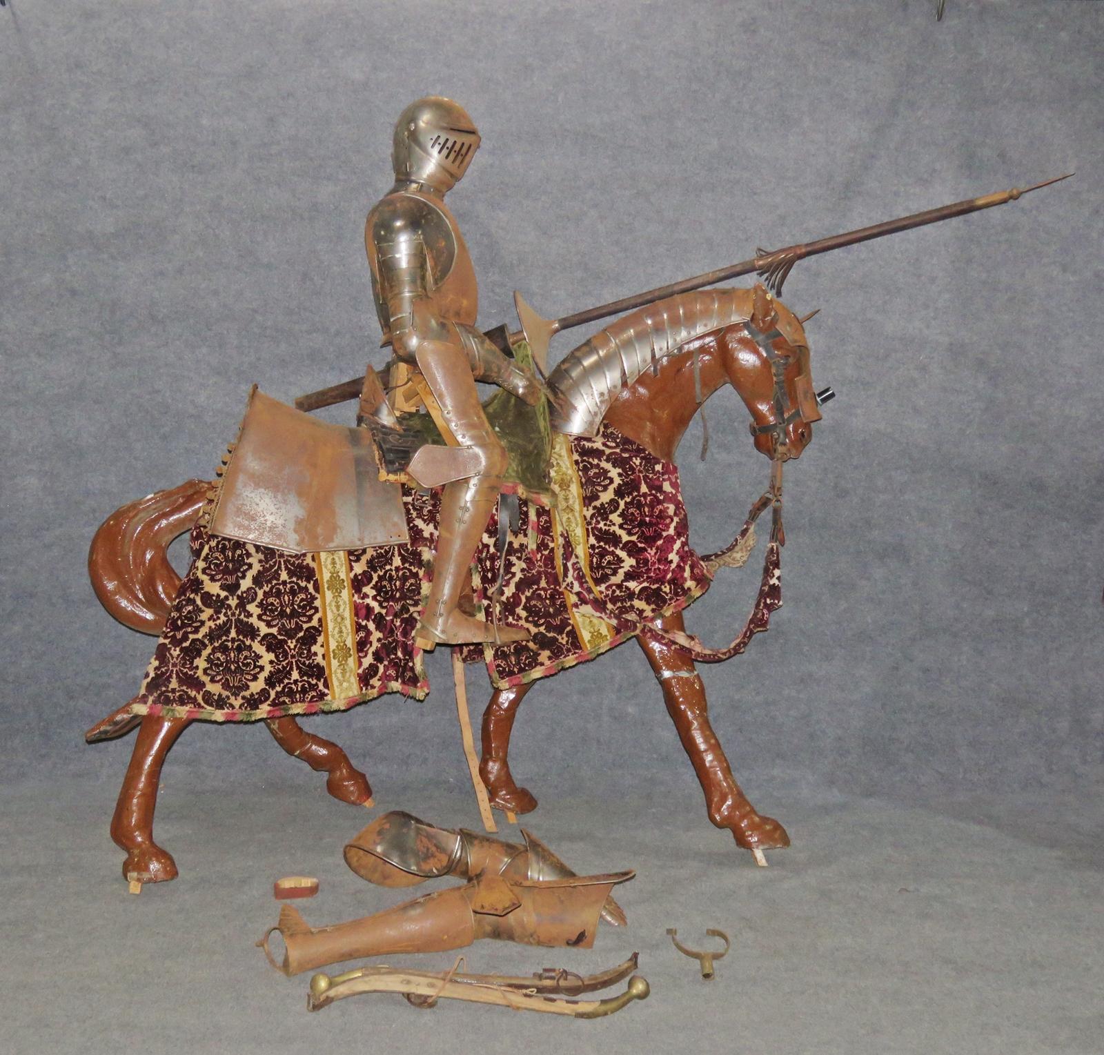 This is a life size suited man on horse with all of the items shown here included. This is a rare and unusual piece to place in yoru castle and make a strong impression. Horse is paper mache but the rider is metal. There are old repairs to the