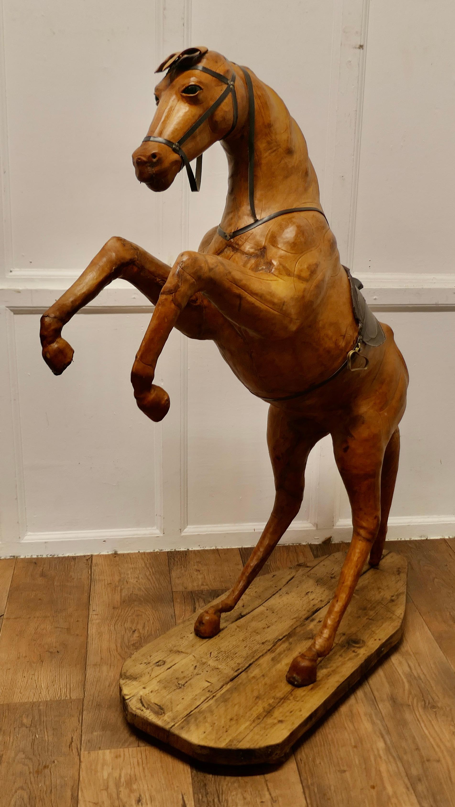 Life Size Arts and Crafts Leather Model of a Horse

Almost Life Size Leather Horse
This is a rare and beautiful find, it was made for Liberty but the label is no longer attached 
This handsome beast is free standing in a rearing position
The
