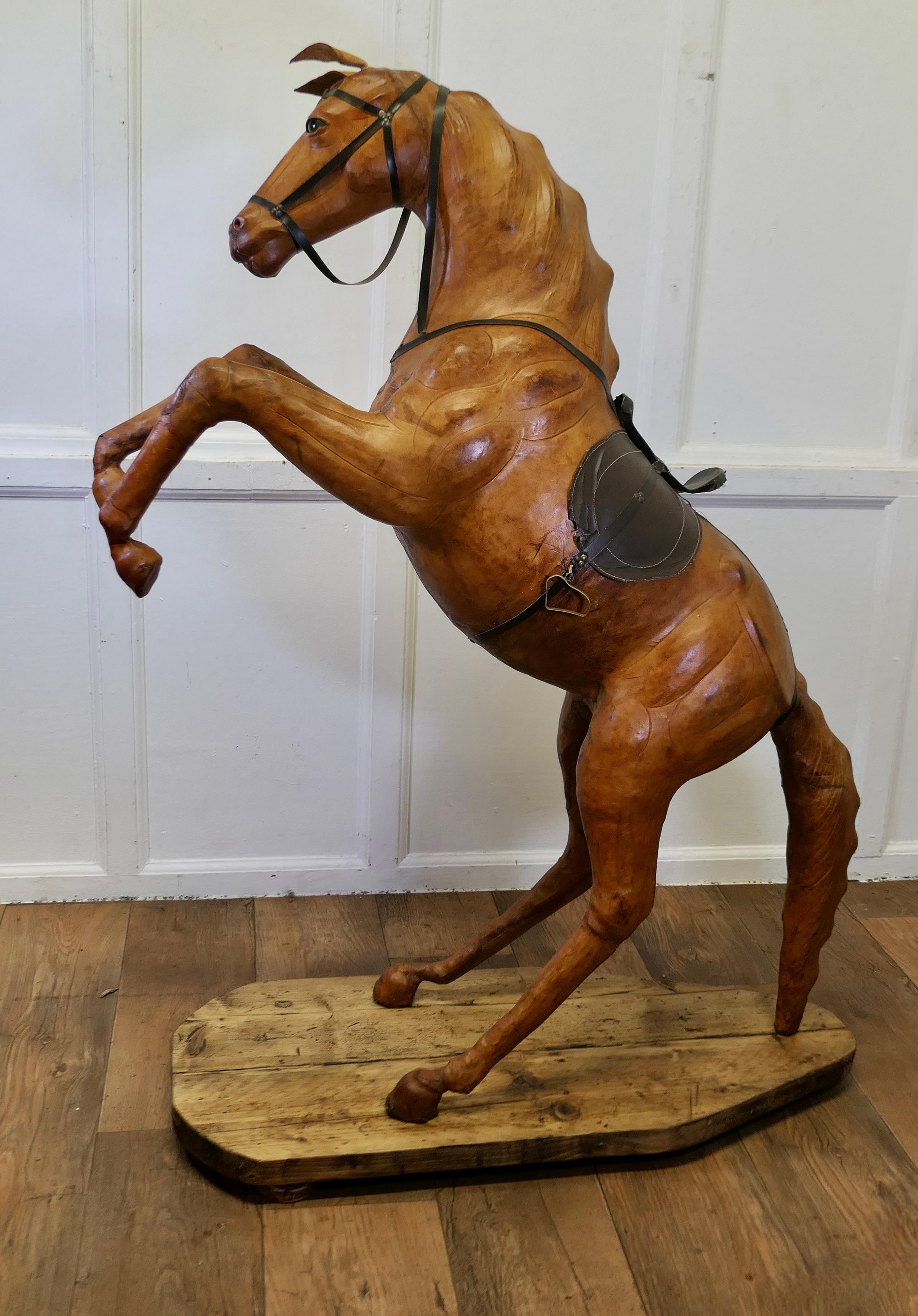 Life Size Arts and Crafts Leather Model of a Horse

Almost Life Size Leather Horse
This is a rare and beautiful find, it was made for Liberty but the label is no longer attached 
This handsome beast is free standing in a rearing position
The