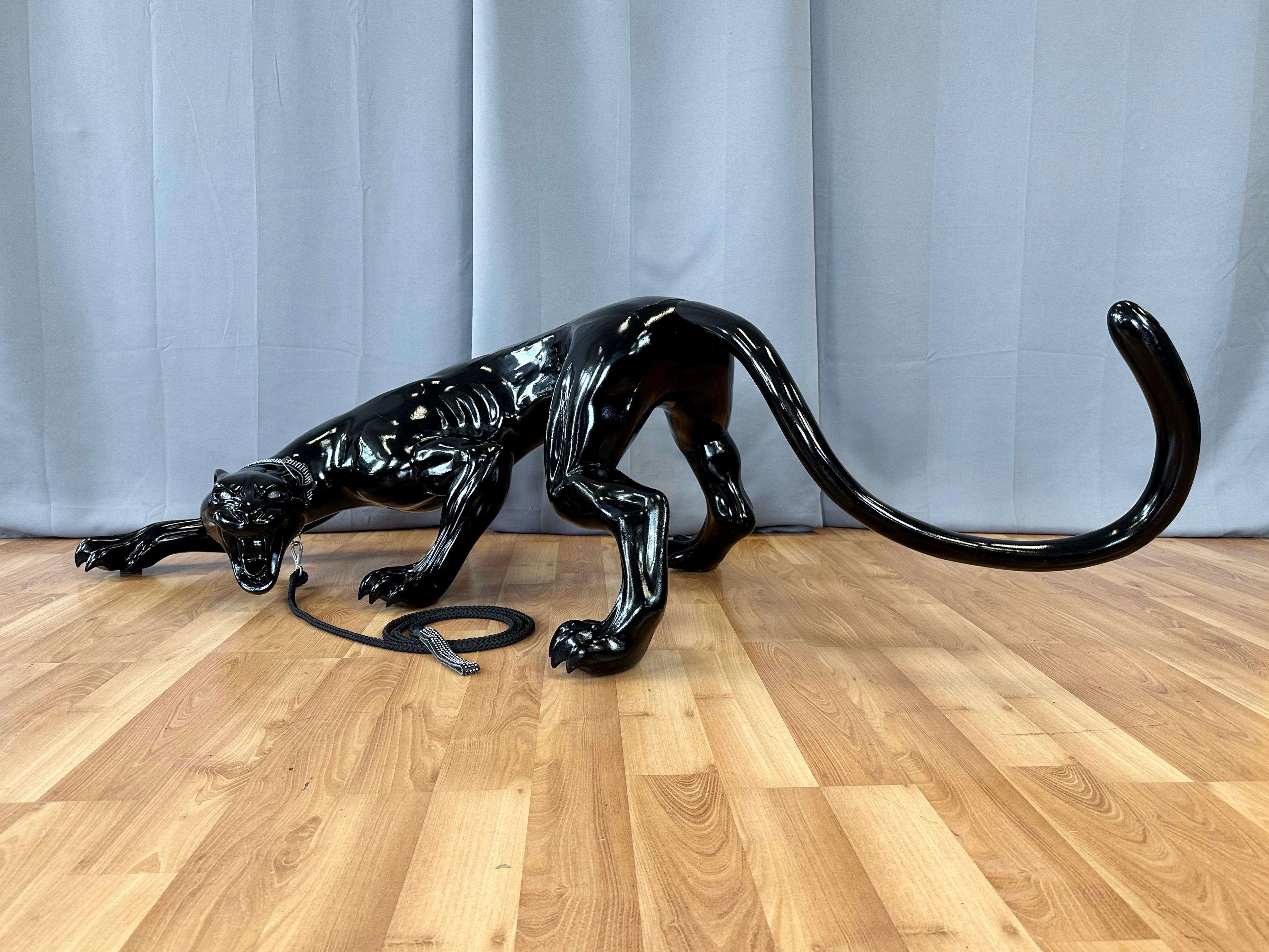 A magnificent and rare circa 2005 life-size black panther sculpture in fiberglass. Attributed to be a custom made display piece for the Gucci flagship store in San Francisco, California.

Lean, mean, and poised to make a scene, this head-turning