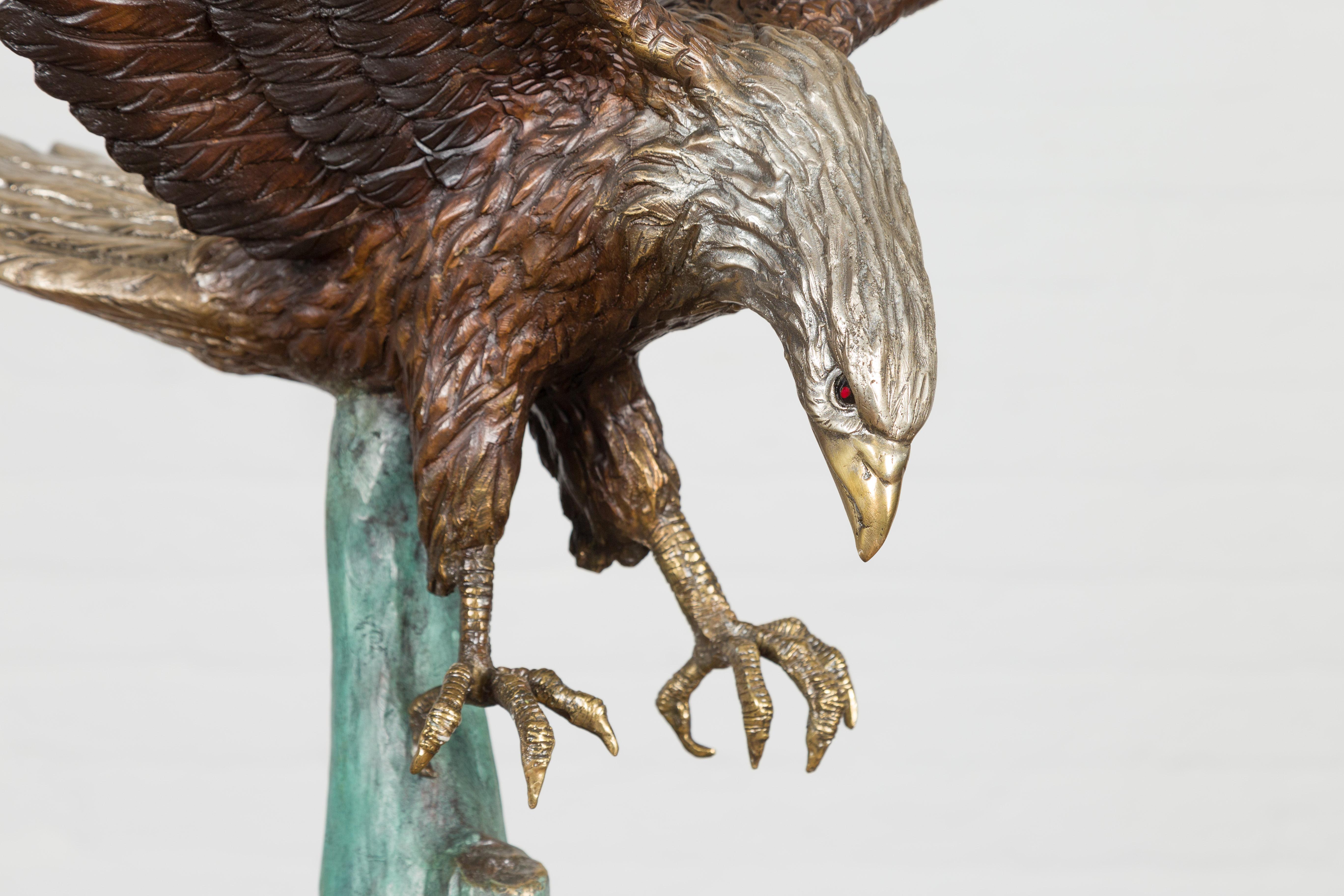 Cast Life Size Bronze Sculpture of a Diving Eagle on Black Marble Base For Sale